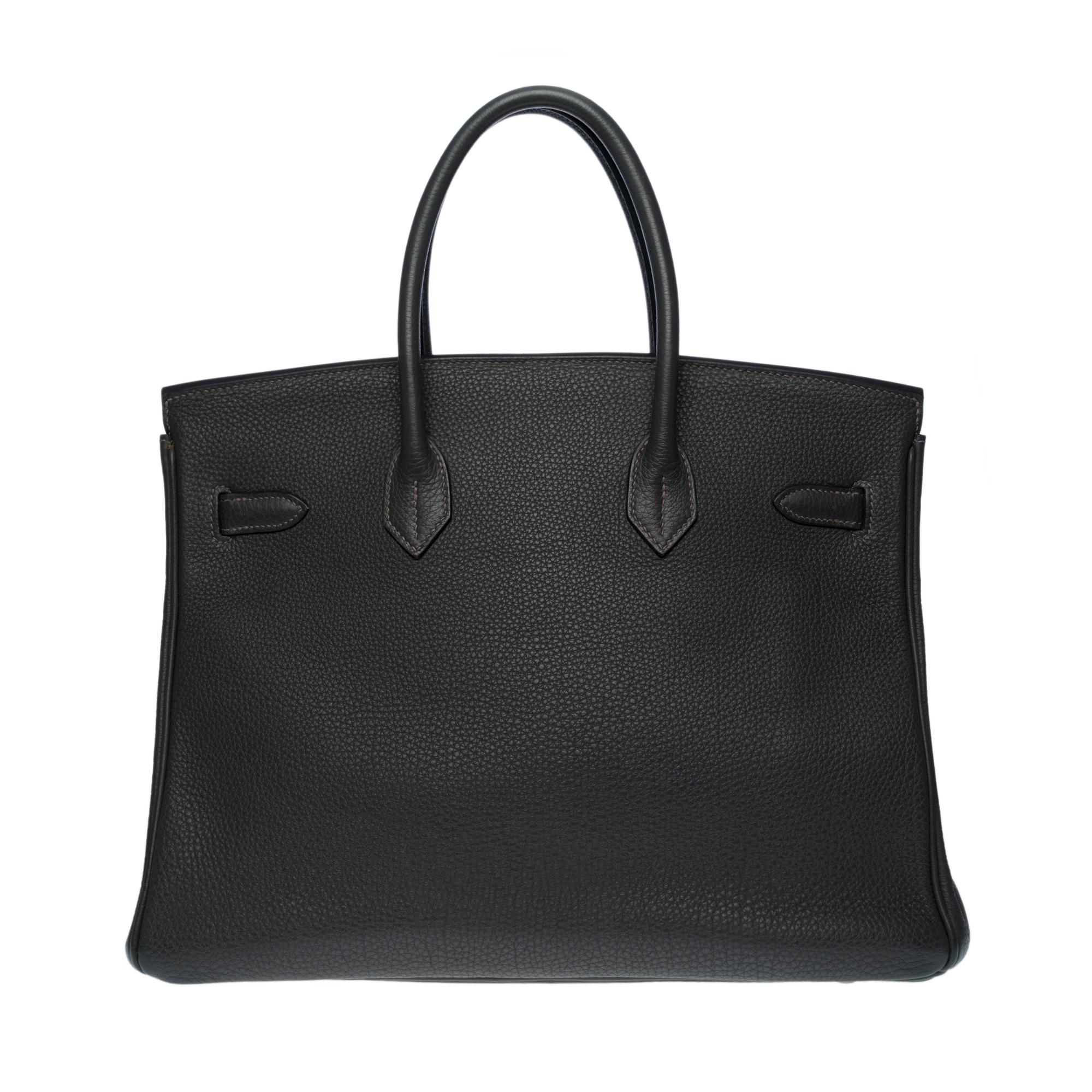 Exquisite Hermes Birkin 35 in Taurillon Clemence grey Graphite, ruthenium metal hardware, double handle in grey leather allowing a hand-carry

Flap closure
Inner lining in grey leather, one zippered pocket, one patch pocket
Signature: 