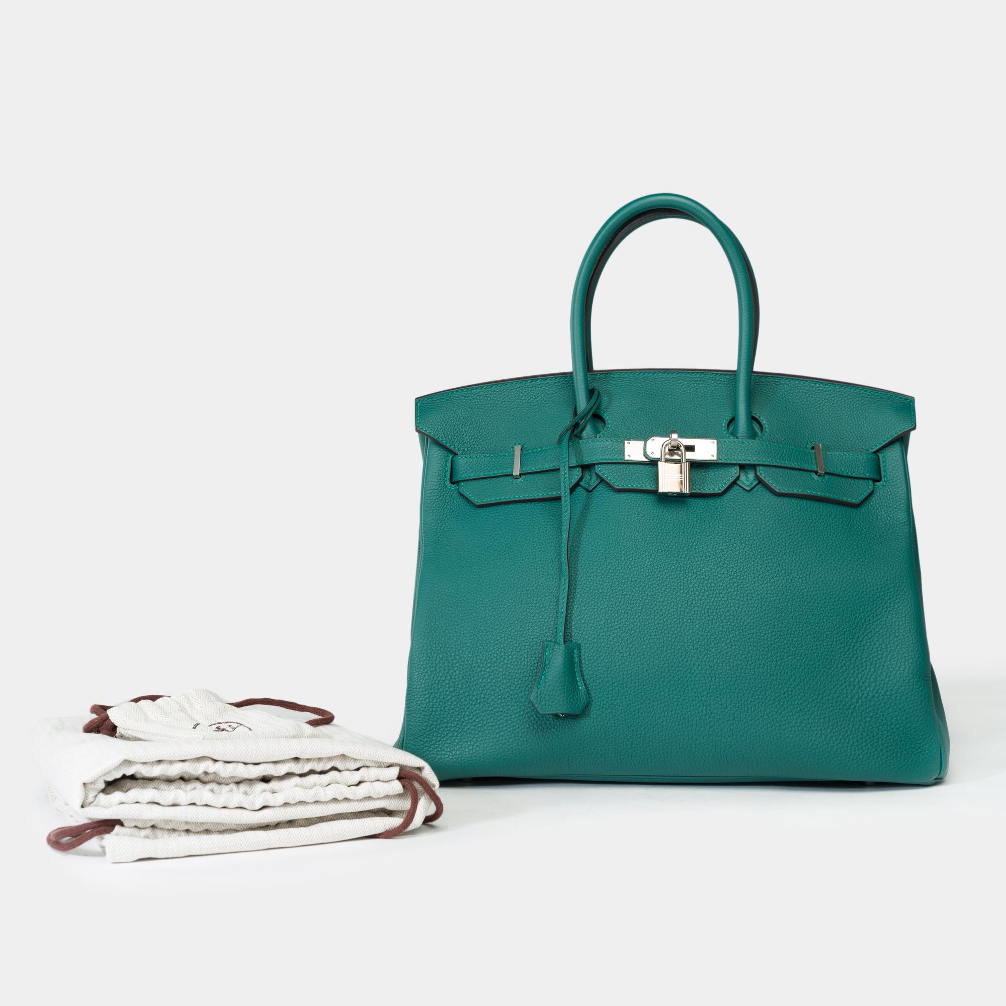 Amazing​ ​Hermes​ ​Birkin​ ​35​ ​handbag​ ​in​ ​Malachite​ ​green​ ​Togo​ ​leather​ ​,​ ​palladium​ ​silver​ ​metal​ ​trim,​ ​double​ ​handle​ ​in​ ​green​ ​leather​ ​allowing​ ​a​ ​hand​ ​carry

Flap​ ​closure
Green​ ​leather​ ​lining,​ ​one​ ​zip​