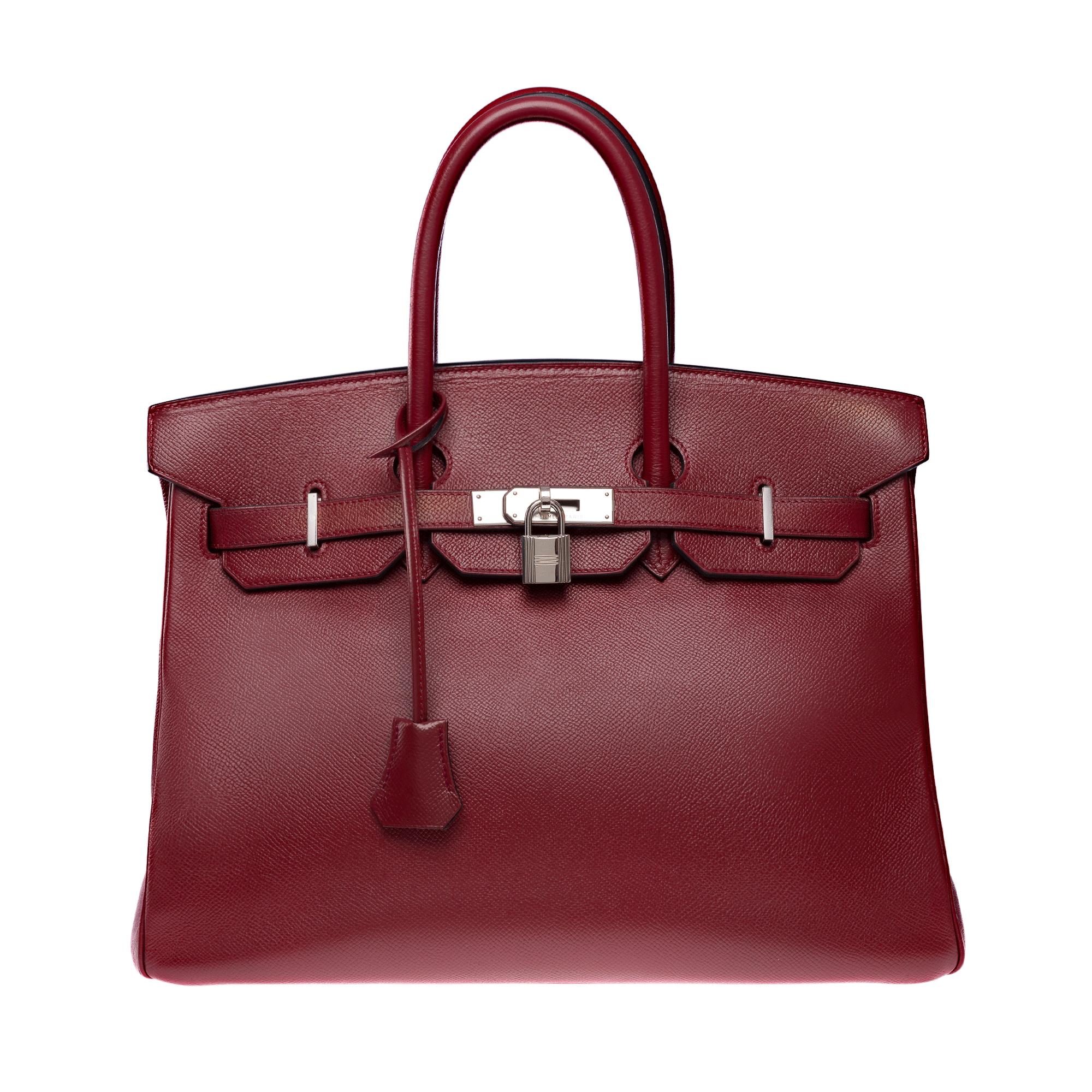 Beautiful​ ​Hermes​ ​Birkin​ ​35​ ​handbag​ ​in​ ​Courchevel​ ​(epsom)​ ​Red​ ​H​ ​(burgundy)​ ​calf​ ​leather,​ ​silver​ ​Palladium​ ​metal​ ​trim,​ ​double​ ​red​ ​leather​ ​handles​ ​for​ ​hand​ ​carry

Flap​ ​closure
Red​ ​leather​ ​interior​