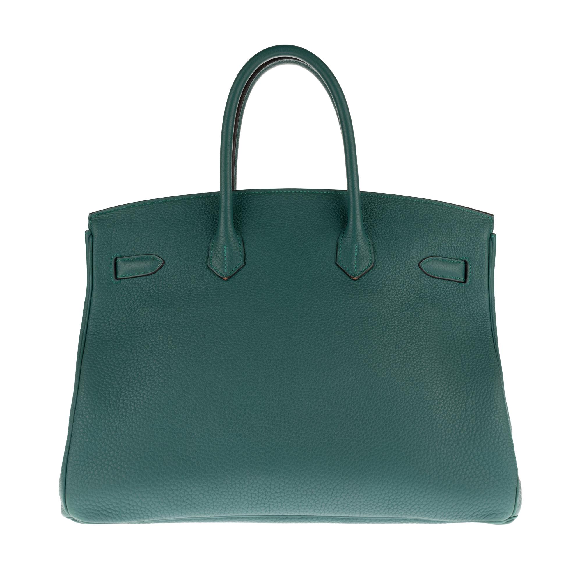 Stunning handbag Hermes Birkin 35 cm Togo leather color green Malachite , Palladium harware, double handle in green leather allowing a handheld.

Closure by flap.
Green leather inner lining, zippered pocket, plated pocket.
Signature: 