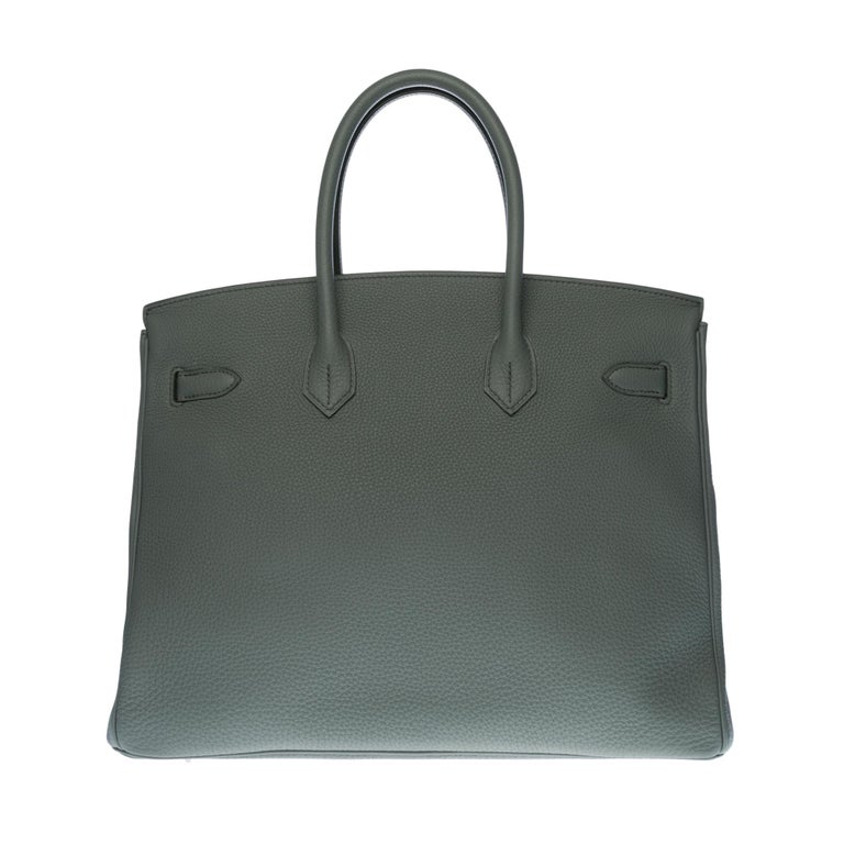 Beautiful Hermes Birkin 35 handbag in Vert amande (almond green) Togo leather, silver palladium metal hardware, double handle in green leather allowing a handheld
Flap closure
Lining in green leather, one zip pocket, one patch pocket
Signature: