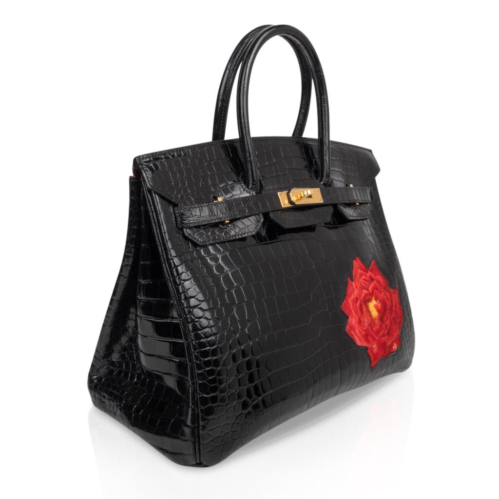 Mightychic offers an extraordinary one of a kind Hermes 35 Birkin HSS bag. 
Black porosus crocodile with the dewdrop detailed La Rosee red velvet rose on front. 
This special order Birkin bag is show stopping!
Red interior and gold hardware.
Rich