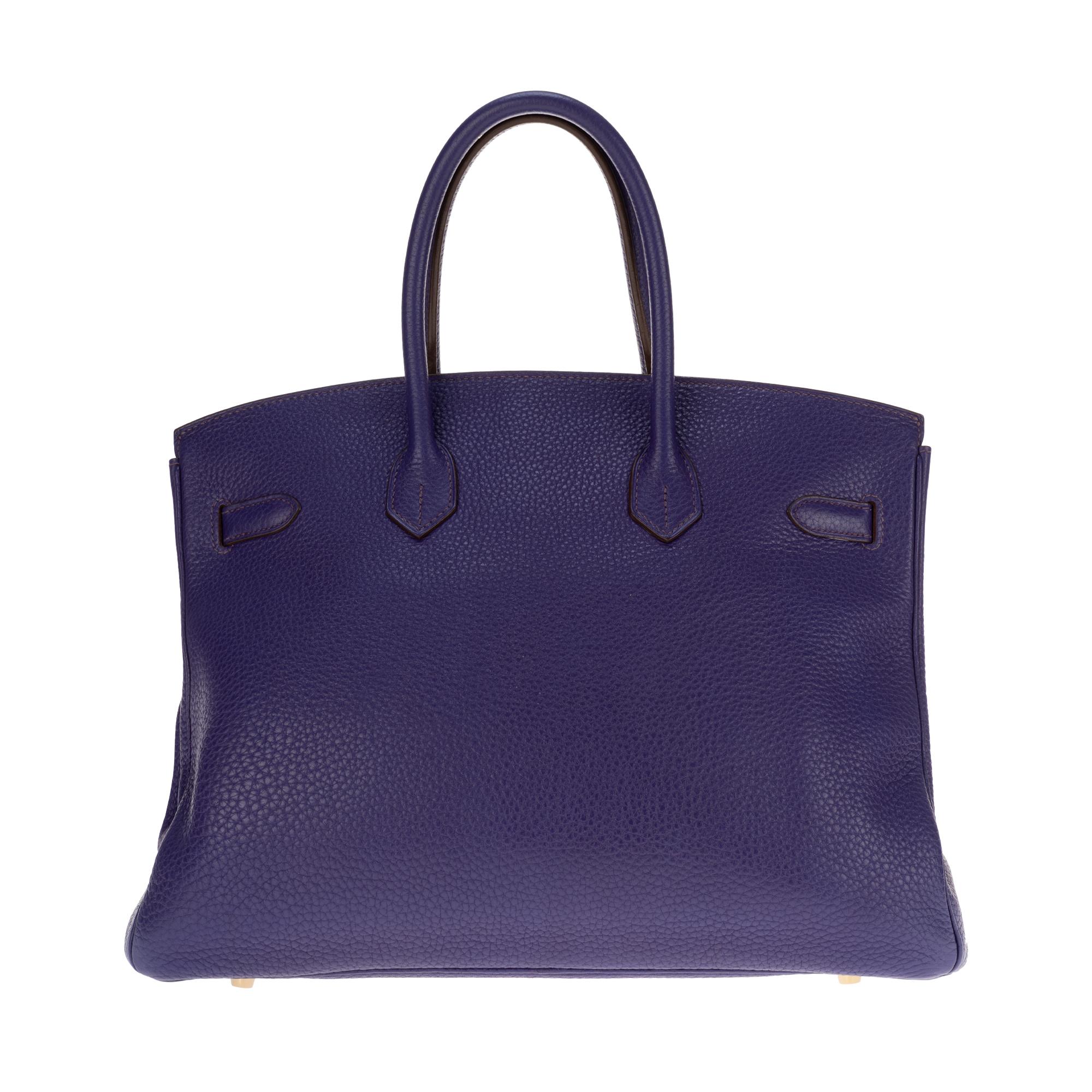Stunning and rare Hermes Birkin handbag 35 cm in Togo purple leather, gold-plated hardware, double handle in purple leather for a hand-held. Flap closure. Purple leather inner lining, zipped pocket, patch pocket.

Signature: 