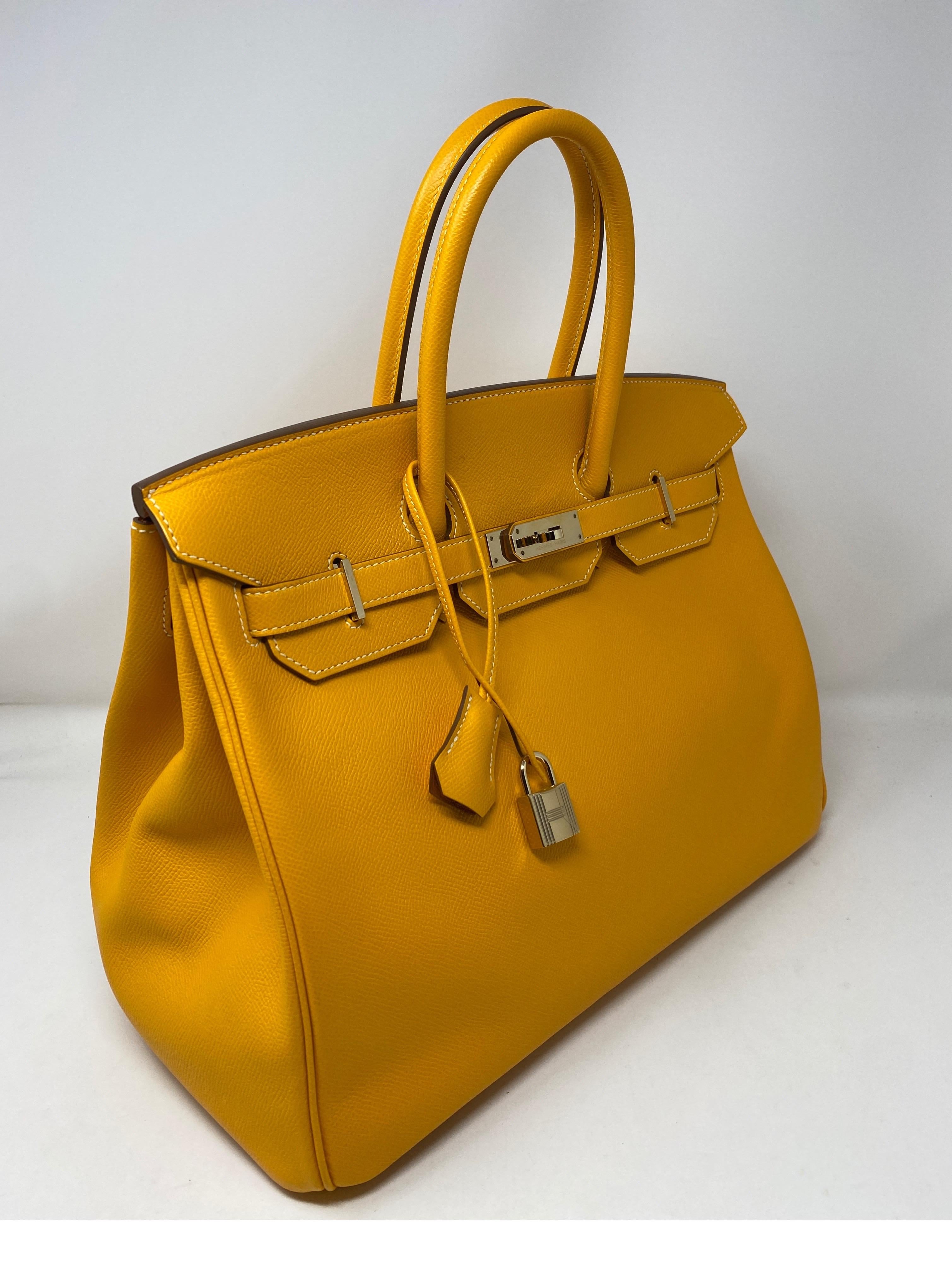 Hermes Jaune D'or Candy Birkin Bag. Candy interior d'or orange color. Exterior yellow Jaune color. Epsom leather. Permabrass hardware. P stamp. From 2012. Looks brand new. Plastic still on hardware. Bright yellow color Birkin. Great addition to your