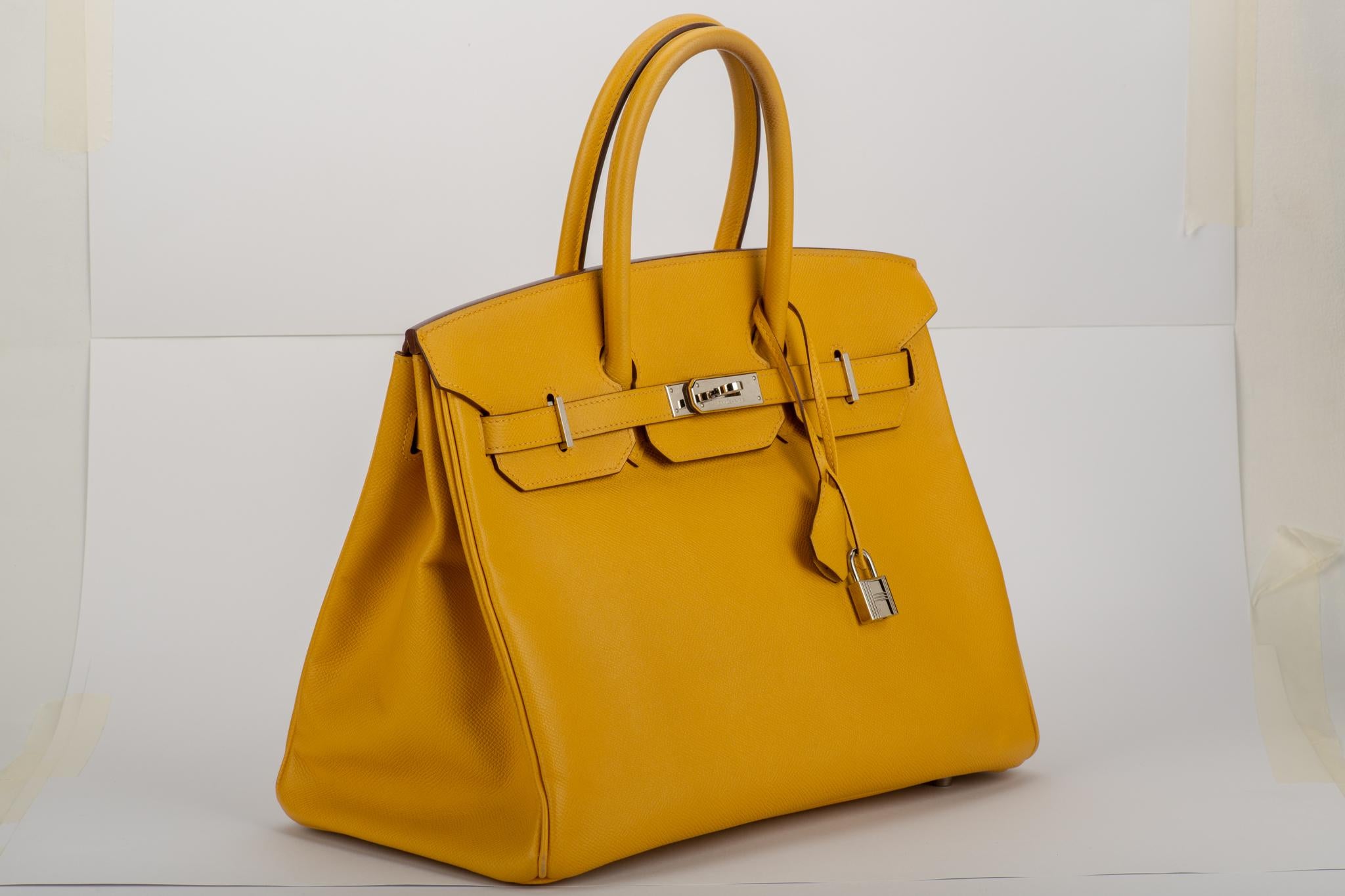 Hermes rare birkin 35 cm in jaune d'or epsom leather with palladium hardware. Date stamp M for 2009. Comes with clochette, tirette, two locks, keys, generic dust cover.