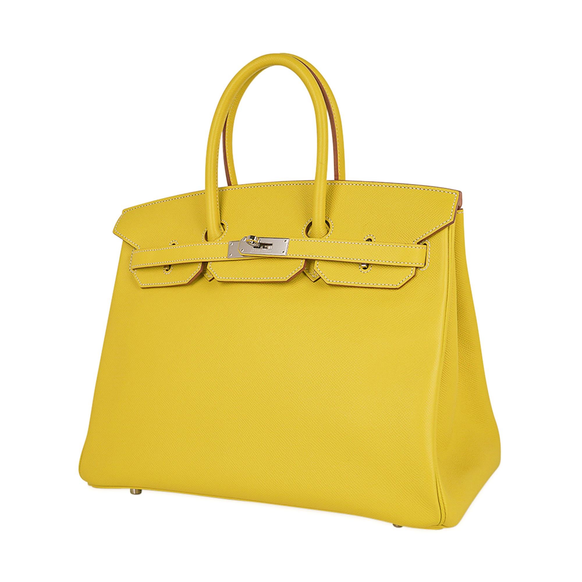 Mightychic offers a rare Limited Edition Candy Hermes Birkin 35 bag featured Lime with Gris Perle interior.
Fresh with palladium hardware.
Epsom leather maintains the shape of the bag is is lighter in weight.
This yellow Birkin bag is a jewel to add
