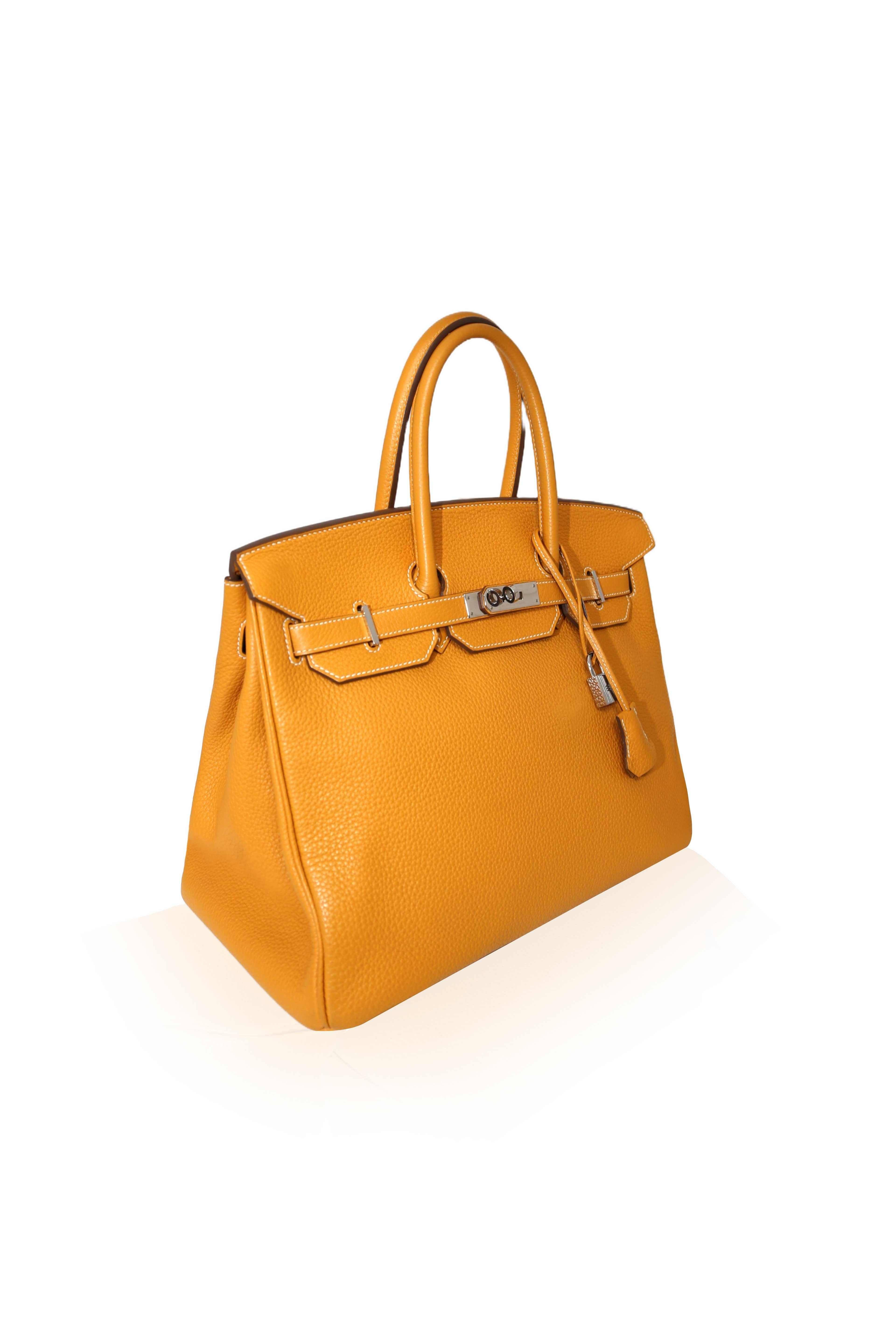 In 1984, Hermès CEO Juan-Louis Dumas boarded a flight and sat beside Jane Birkin. As she stowed away her straw handbag, the contents fell to the floor. As Birkin gathered her belongings, she explained to Dumas that she had not been able to find a