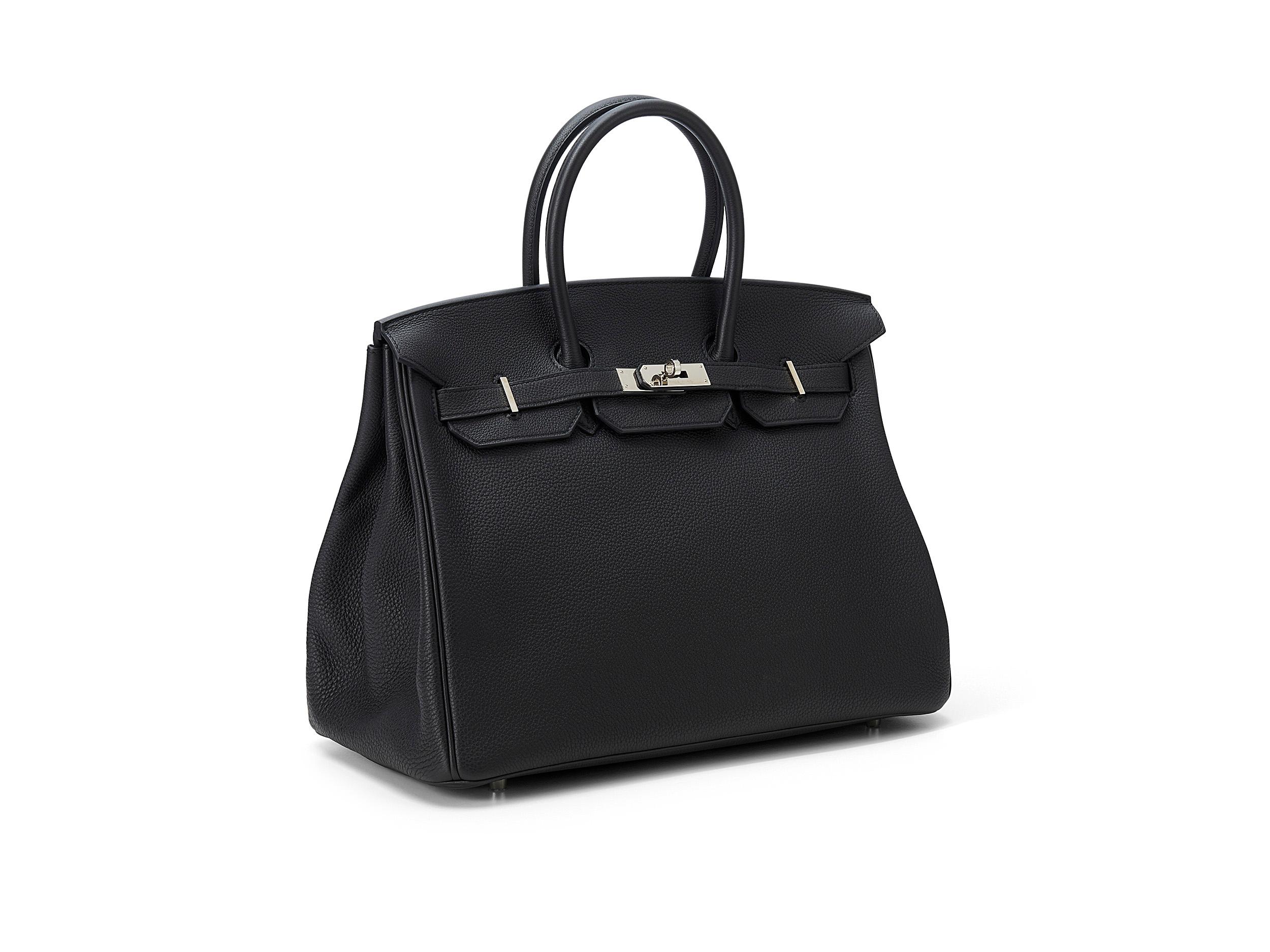 Hermès Birkin 35 in noir and togo leather with palladium hardware. The bag is in a good condition, the hardware and the lock have scratches and discoloration. Comes as full set including the original receipt. Stamp A (2017) 

