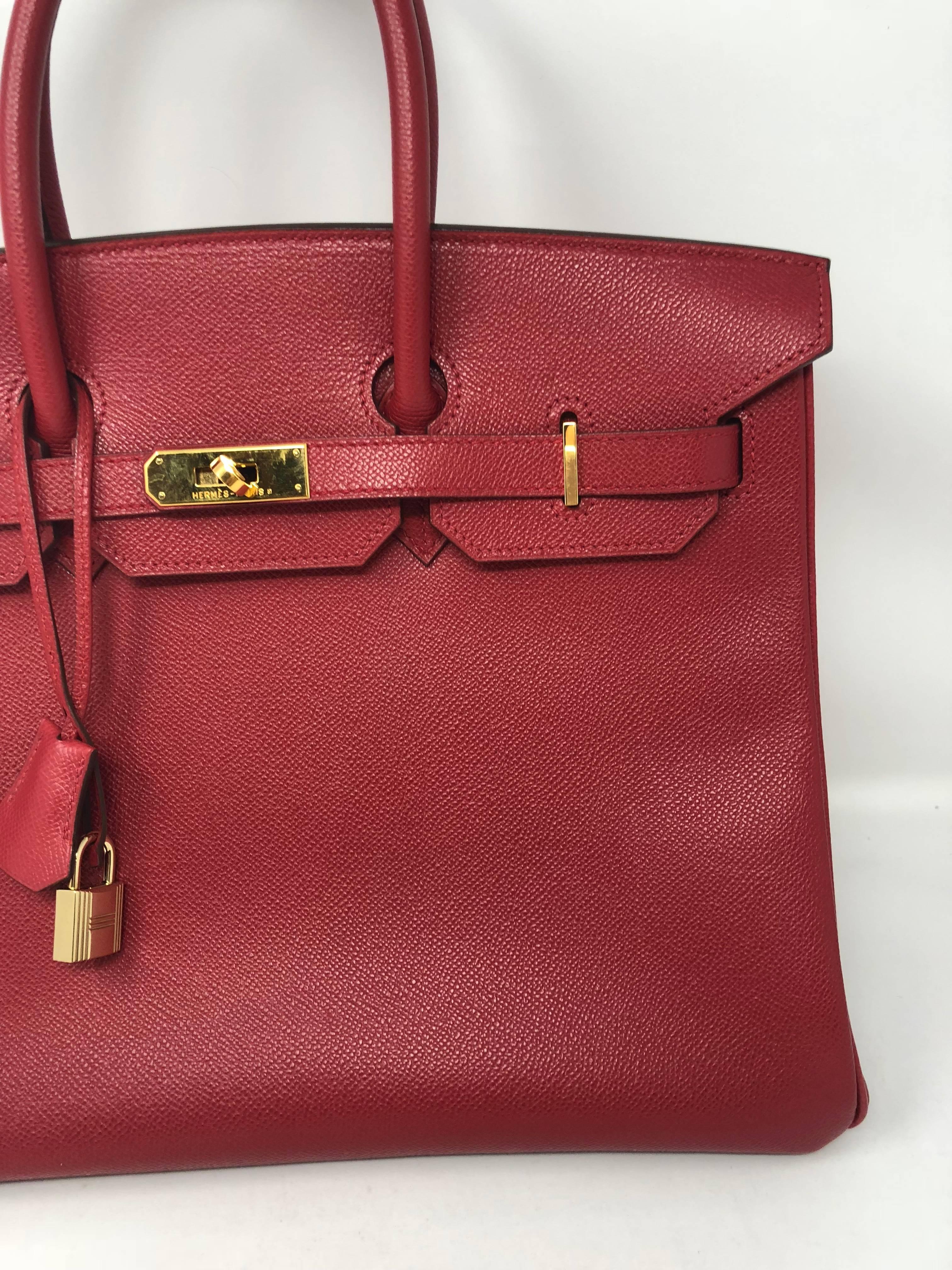 Hermes Red Birkin 35 with gold hardware. Mint condition. Beautiful rich red color. Comes with clochette, keys and dust cover. Guaranteed authentic. 