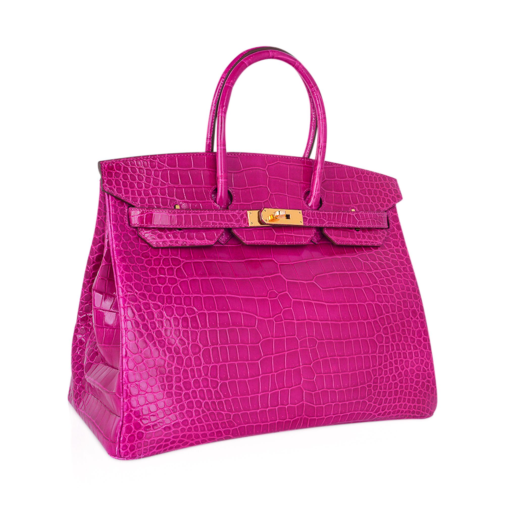 Mightychic offers an Hermes Birkin 35 Rose Scheherazade Porosus Crocodile.
This pink crocodile Birkin bag is breathtaking in its depth of color and beauty of scales.
Rich with gold Birkin bag hardware this genuine crocodile skin bag is a