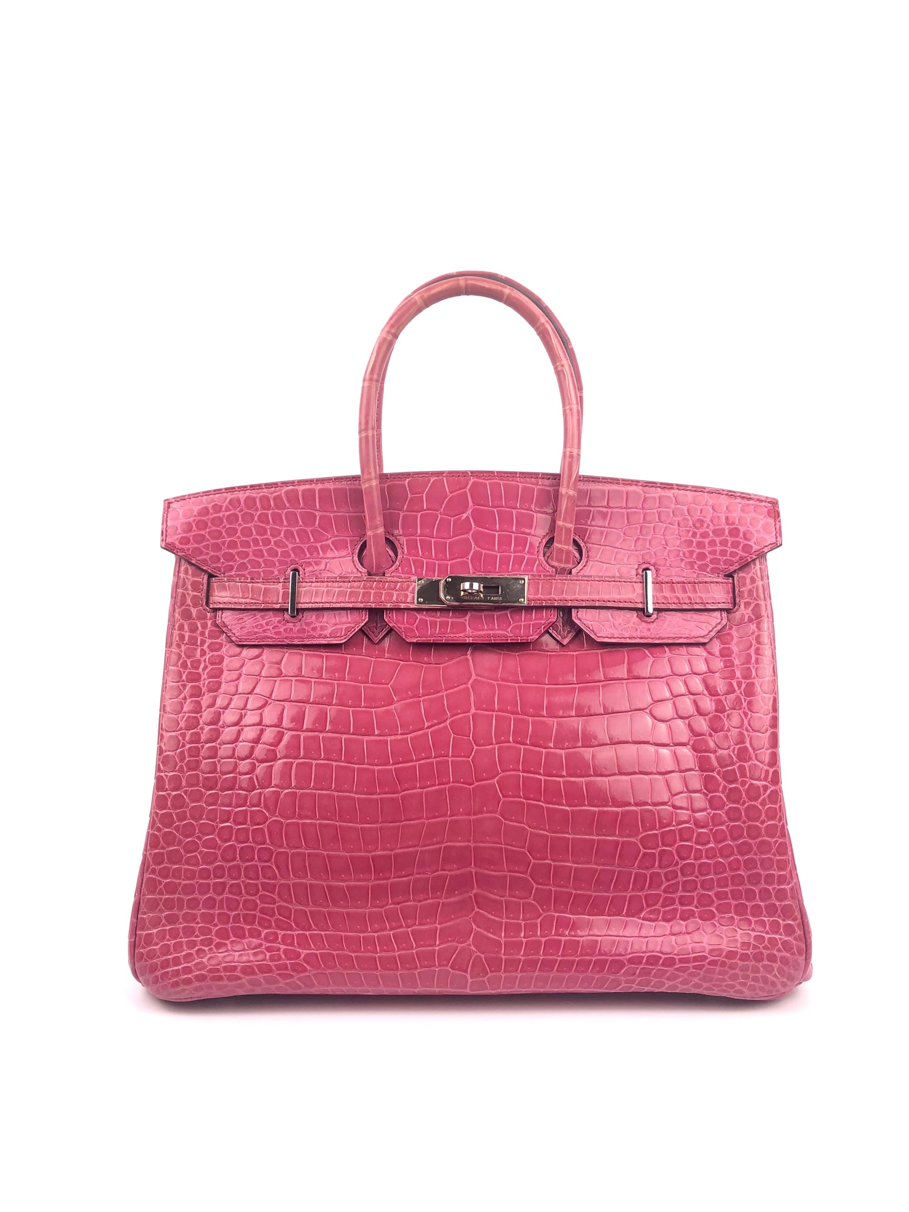 Stunning Hermès Birkin 35 Rose Tyrien Pink Crocodile. Excellent Condition with plastic on hardware with some regular signs of use. 

Shop with confidence from Lux Addicts. Authenticity Guaranteed! 