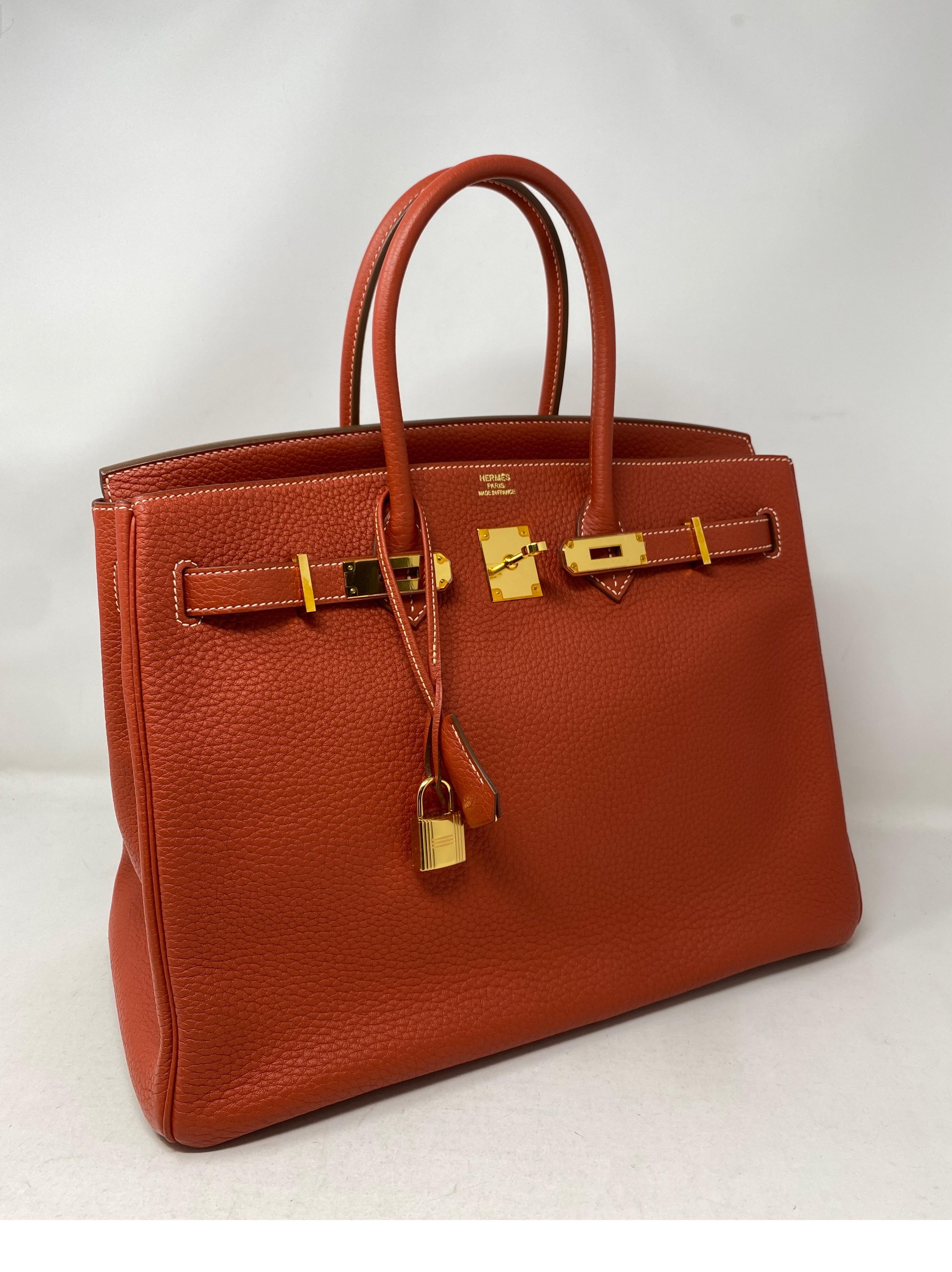 Hermes Birkin 35 Sanguine Bag. Gold hardware. Excellent condition. Plastic is still on hardware. Vintage but looks like it was never carried. Beautiful neutral color. Sanguine color is hard to find. Includes clochette, lock, keys, and dust cover.