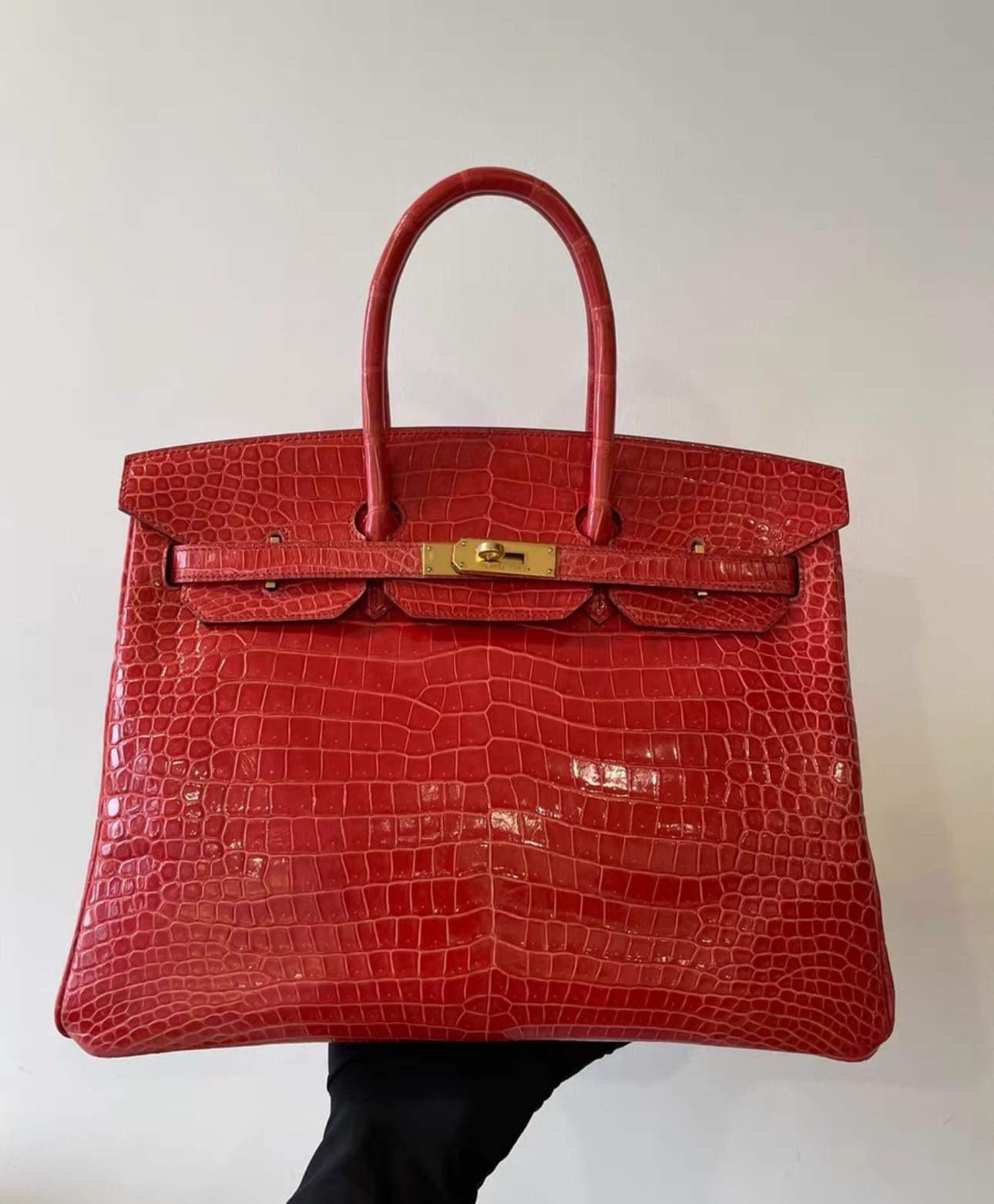 Hermes Birkin 35 Shiny Red Porosus Crocodile Bag with Gold Hardware. Bag comes with dust bag, 2 keys, locker and clochette. No plastic protection on feet.
Guaranteed authentic Hermes Birkin Red 35 Bag.
Porosus Crocodile is the most rare and