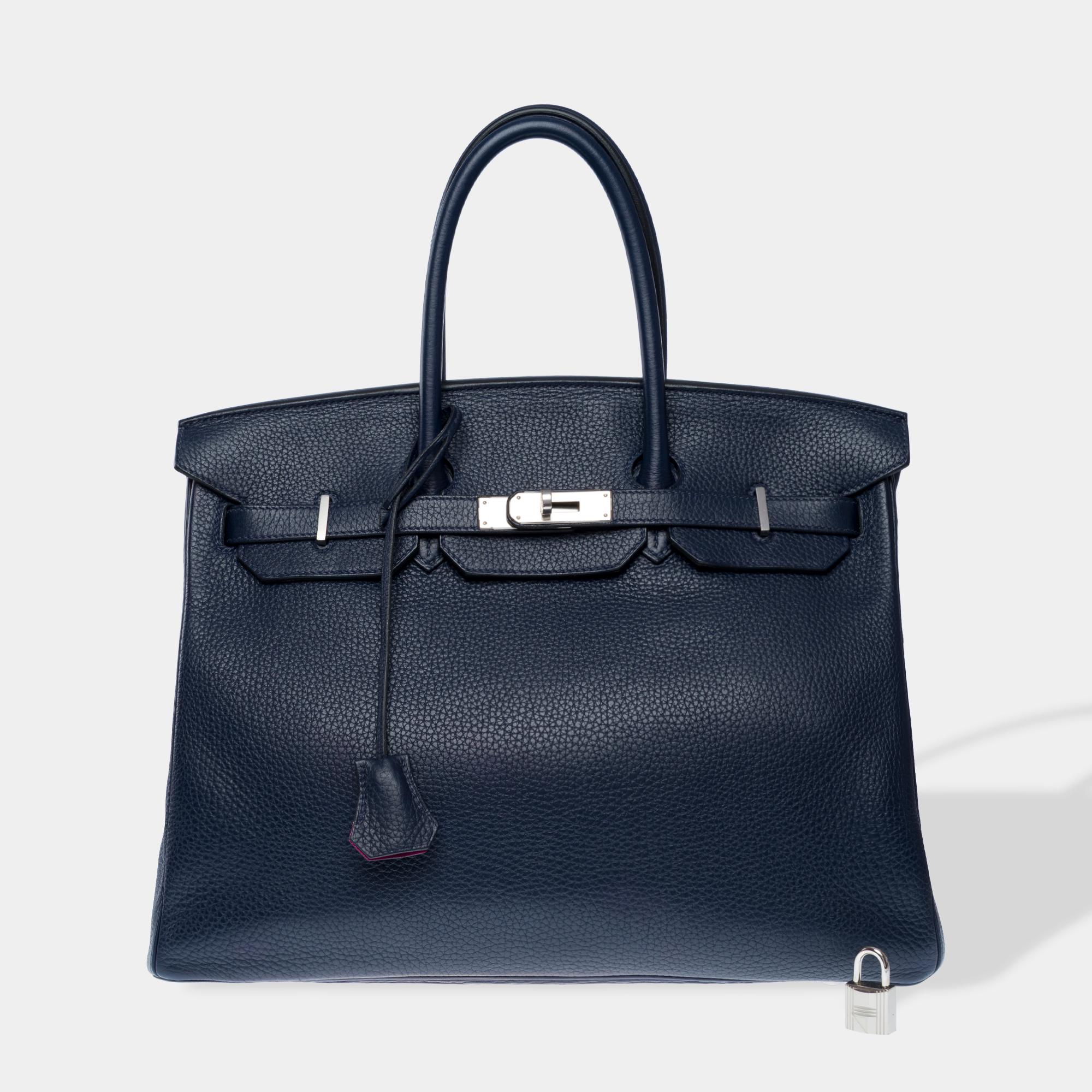 Stunning​ ​Hermes​ ​Birkin​ ​35​ ​Verso​ ​handbag​ ​in​ ​Blue​ ​nuit​ ​Togo​ ​leather​ ​with​ ​Purple​ ​interior​ ​,​ ​silver​ ​Palladium​ ​metal​ ​trim,​ ​double​ ​blue​ ​leather​ ​handles​ ​for​ ​hand​ ​carrying.

Flap​ ​closure
Pink​ ​leather​