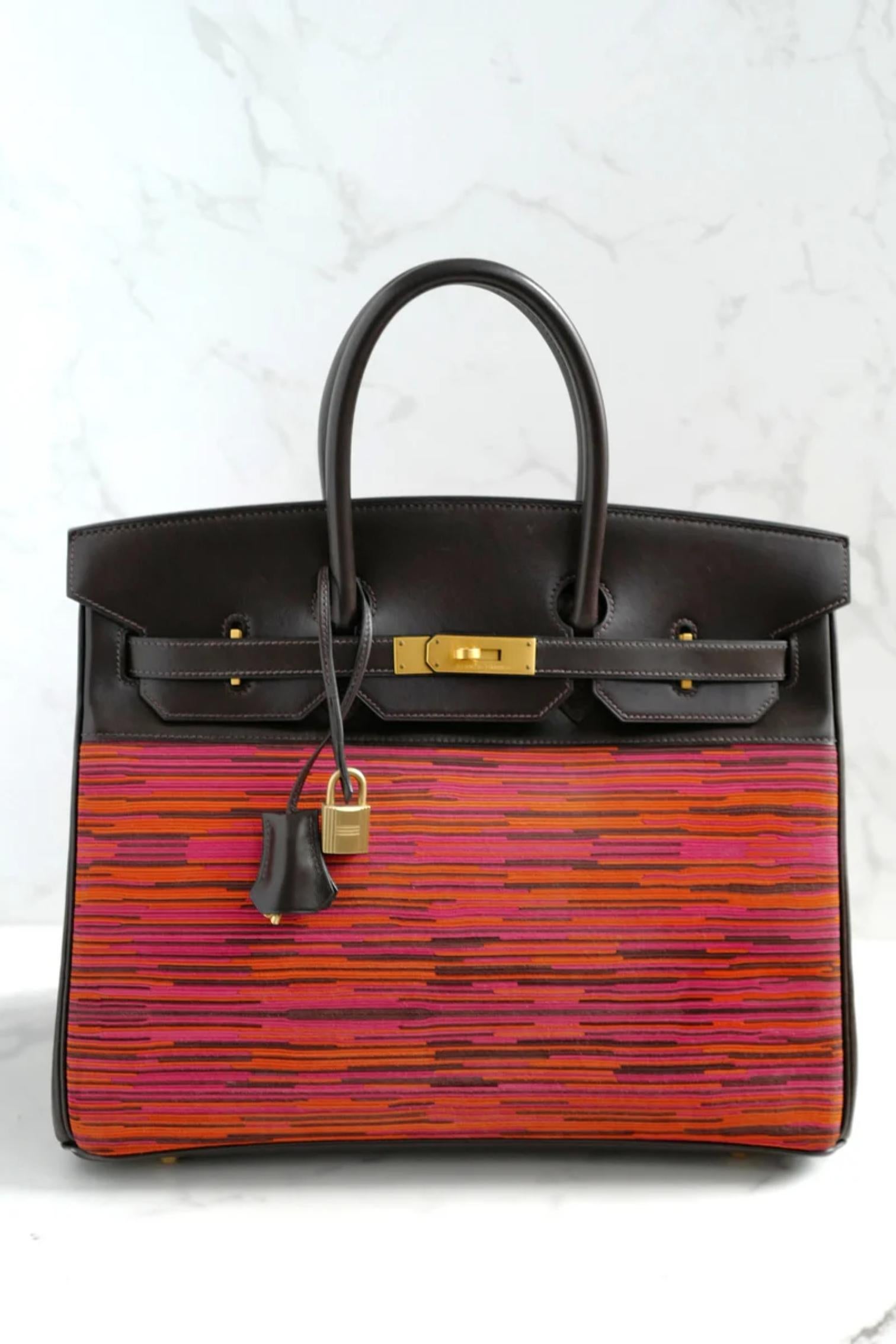 The Hermès Birkin 35 Vibrato in Orange and Fuchsia is a rare and striking piece. It features the unique Hermès Vibrato design, created from thin layers of leather in vibrant shades of orange, fuchsia, and burgundy. The top, handles, and trim are