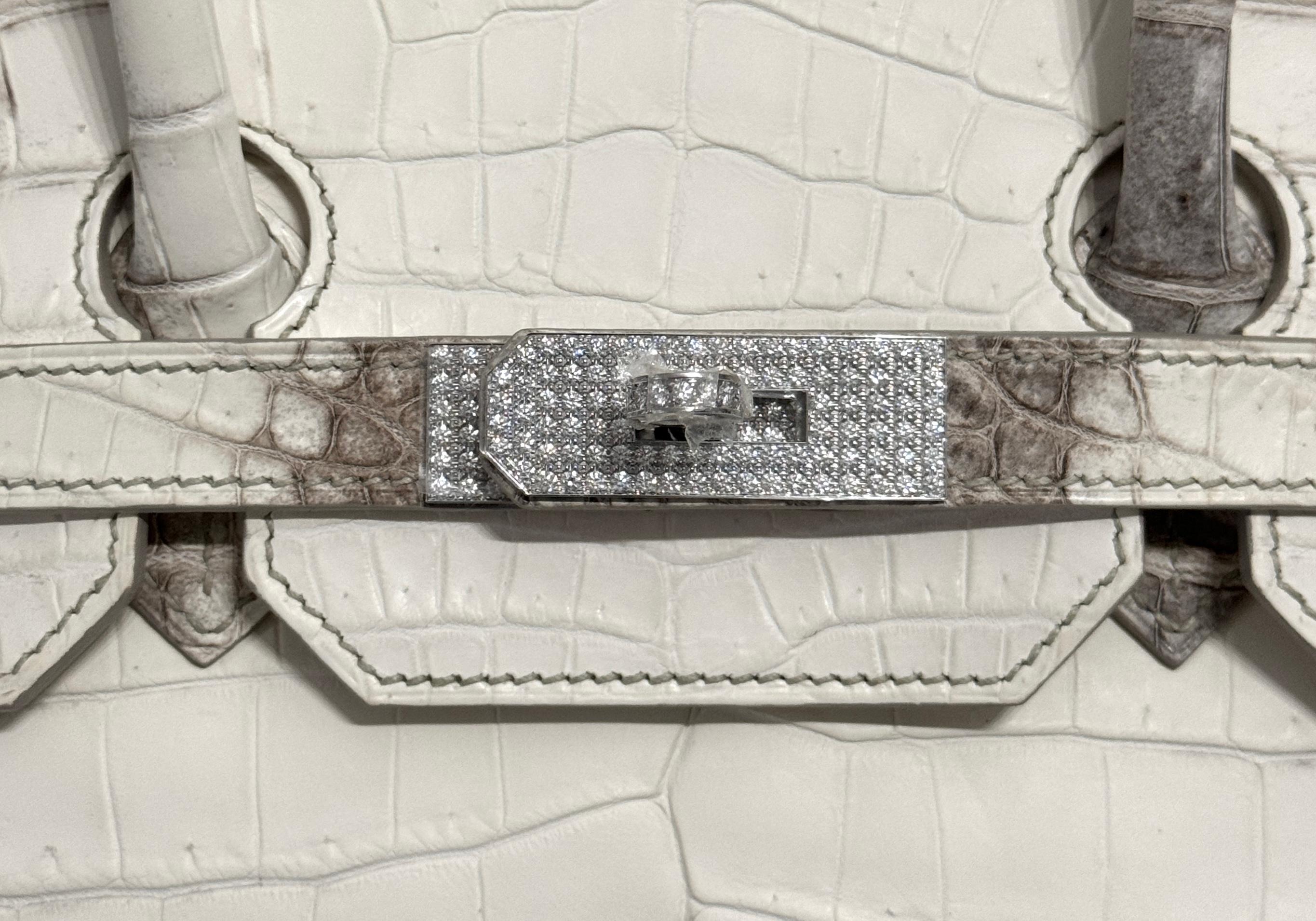 Up for sale is the Holy Grail Hermès Birkin 35 Diamond Himalayan. The Diamond Himalyan is the pinnacle of luxury and elegance, celebrated as one of the rarest and most exquisite handbags in the world. Crafted from Niloticus crocodile leather, the