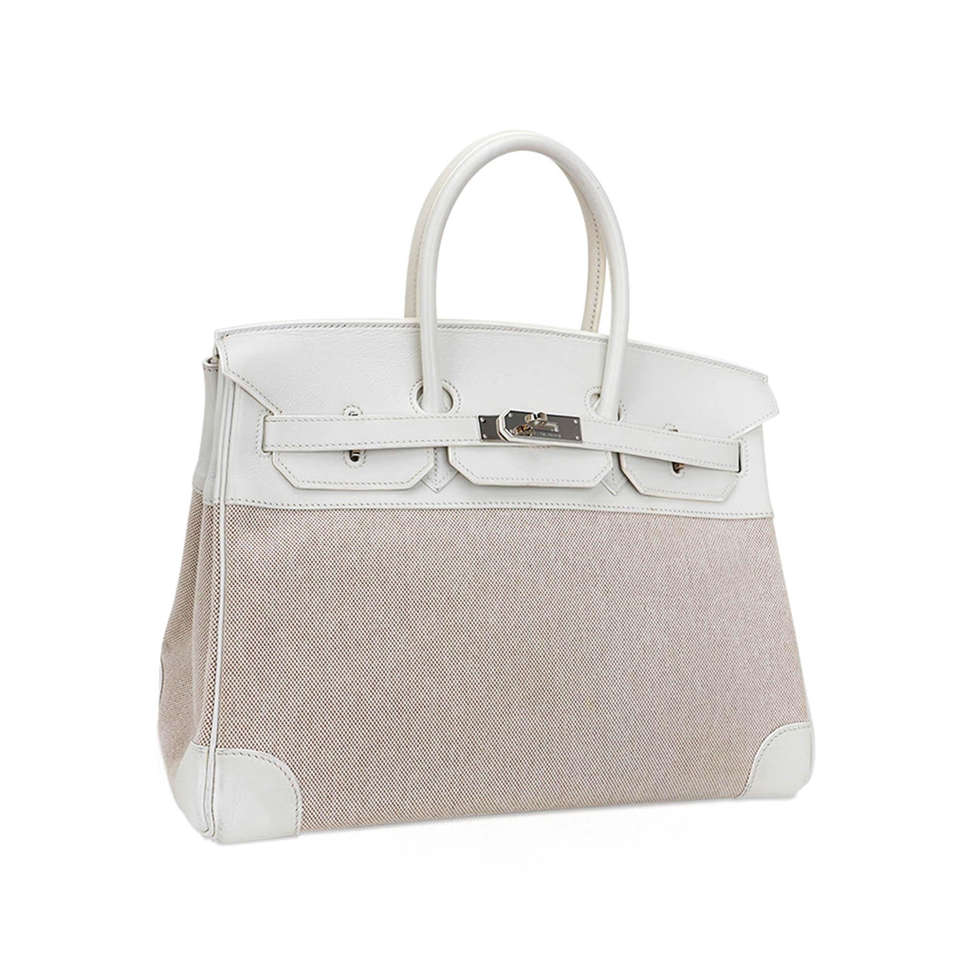 Hermes Birkin 35 bag featured in rare White Swift leather with coveted Toile. 
This very rare bag is a collectors treasure!
A chic combination with Palladium hardware.
Comes with lock, keys, clochette, sleeper and signature Hermes box.
Hardware is