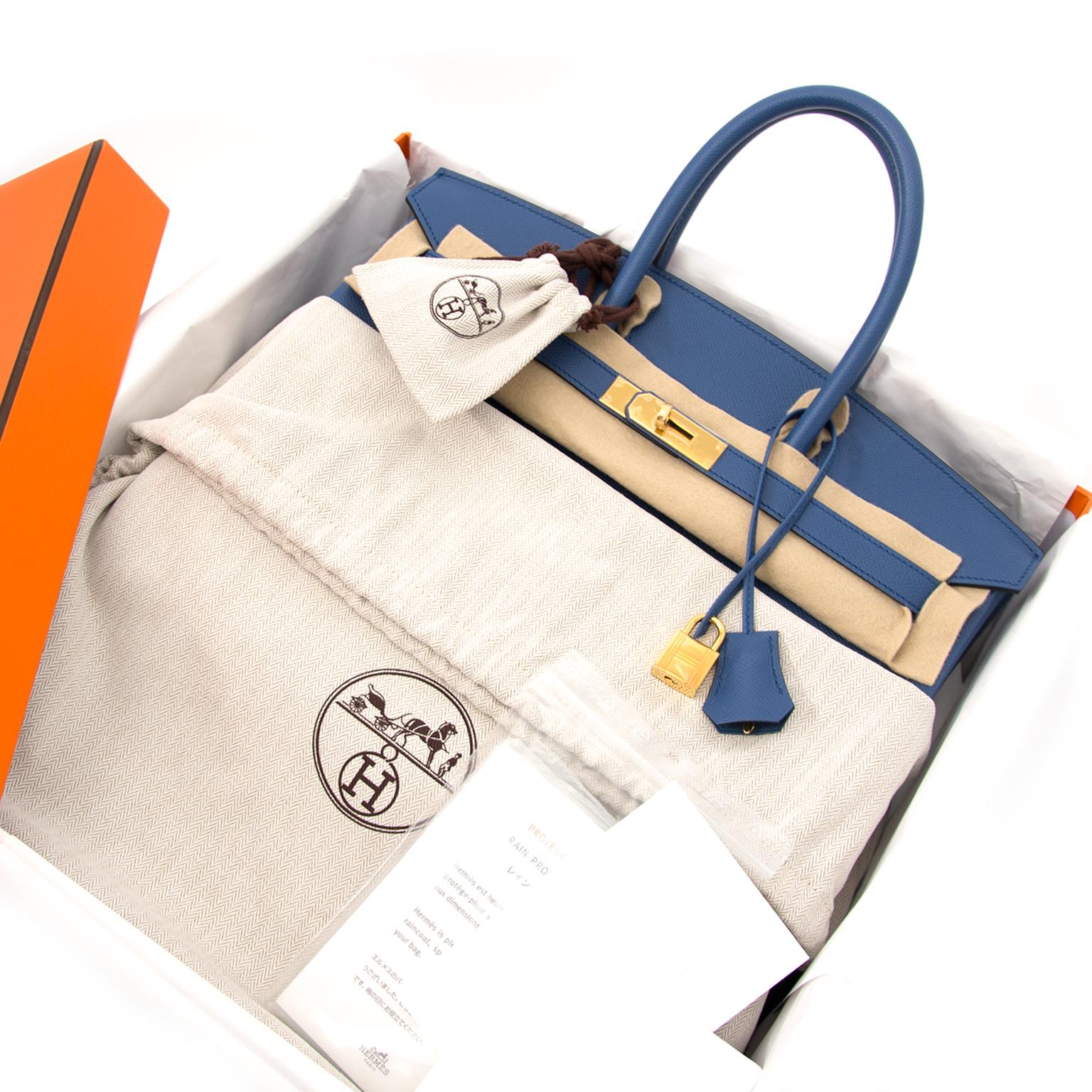 Hermes Birkin 35 Epsom in Bleu Agate which is a bright, but not too bright blue shade and sits somewhere between Bleu Saphir and Bleu Paradis on the colour chart. The gold-tone hardware emphasizes the timeless Bleu Agate Epsom leather body. This