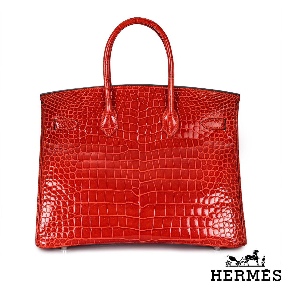 A statement Hermès 35cm Birkin bag. The exterior of this exotic Birkin is in a shiny Geranium Porosus Crocodile with tonal stitching. It adorns palladium hardware, two top handles and front toggle closure. The interior features a zipper pocket with