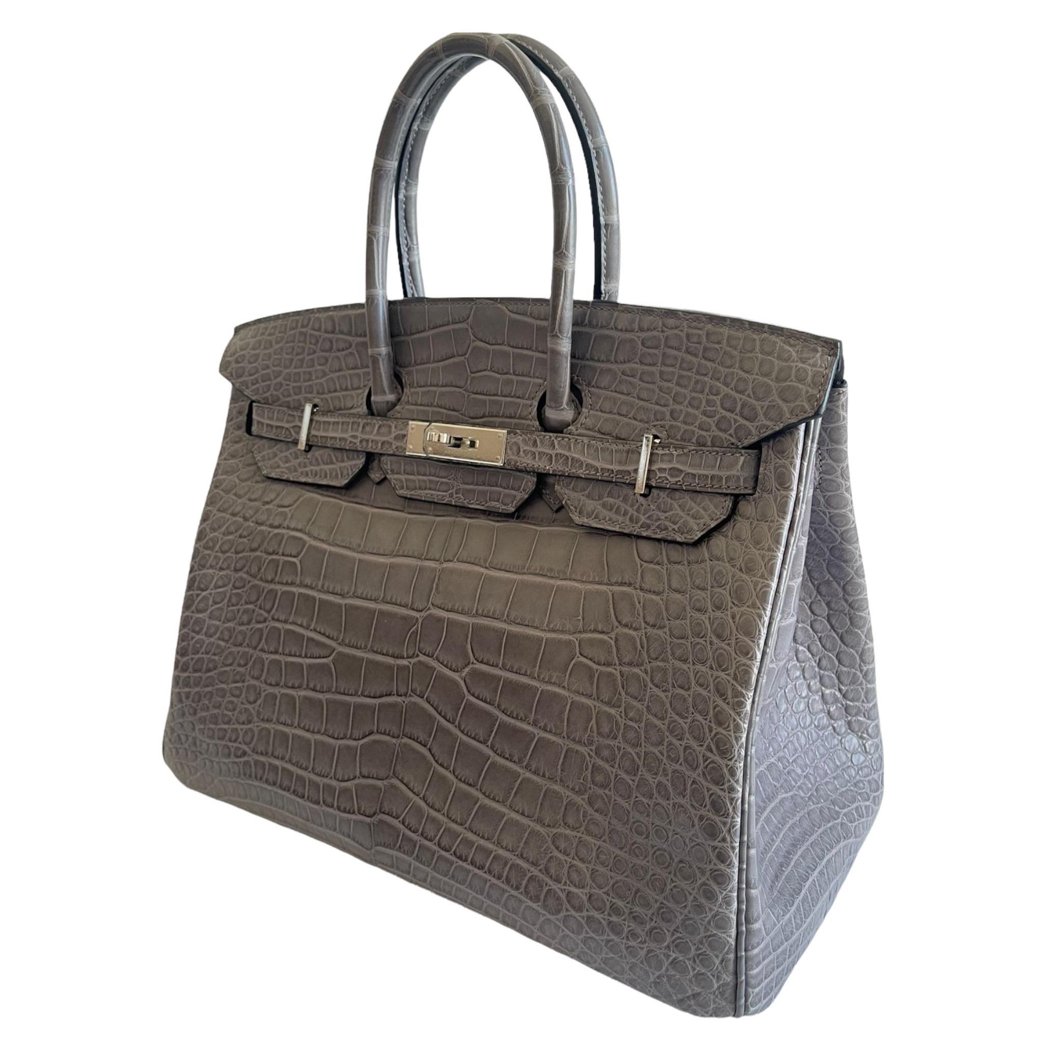 Brand: Hermès 
Style: Birkin Retourne
Size: 35cm
Color: Gris Paris
Leather: Matte Alligator 
Hardware: Palladium
Year: 2013 Q

Condition: Pristine, never carried: The item has never been carried and is in pristine condition complete with all