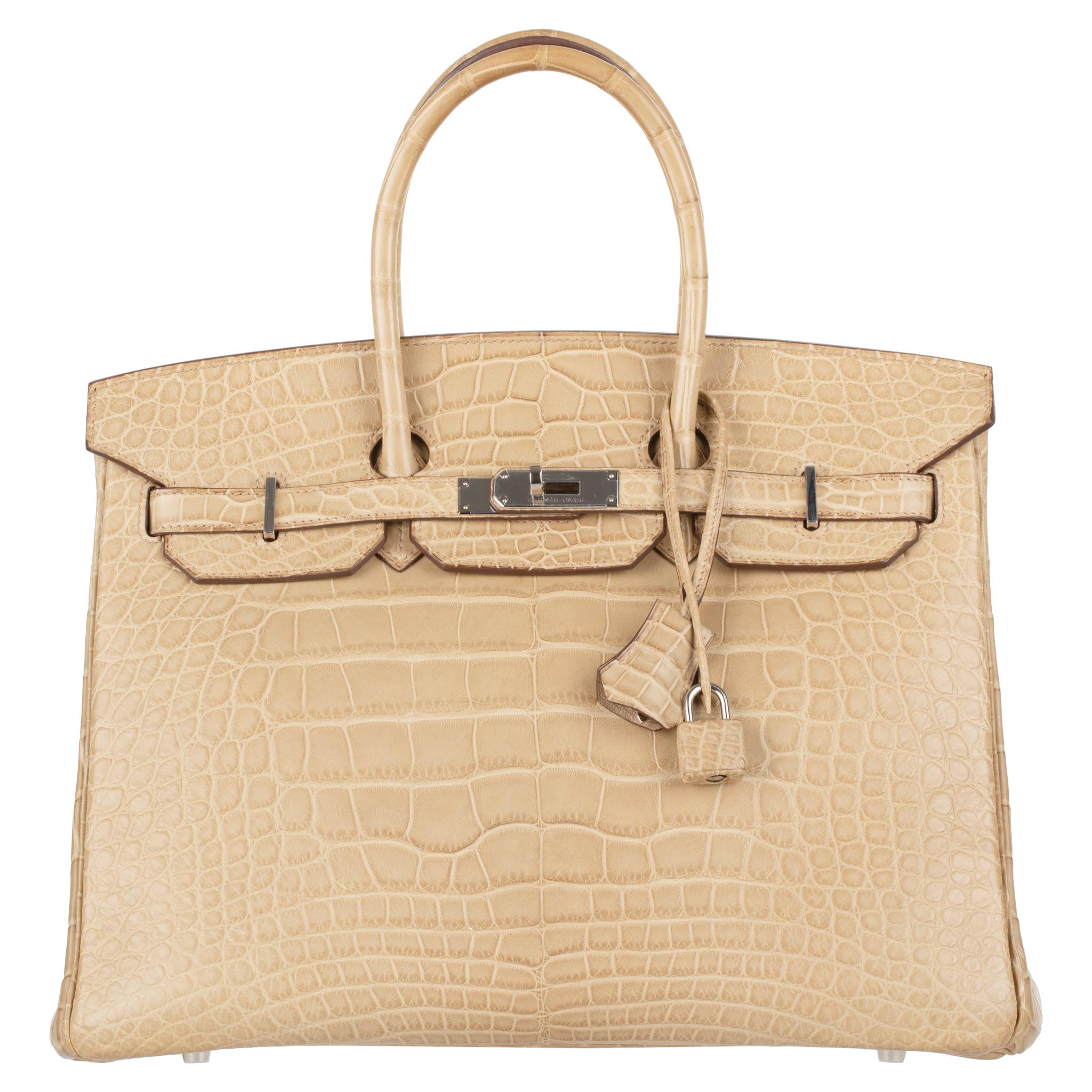 1stdibs Exclusives From Three Over Six

Brand: Hermès 
Style: Birkin 
Size: 35cm
Color: Matte Alligator
Hardware: Palladium
Stamp: 2011 P

Condition: Vintage excellent: This item is vintage and shows natural signs of ageing. This item will also have
