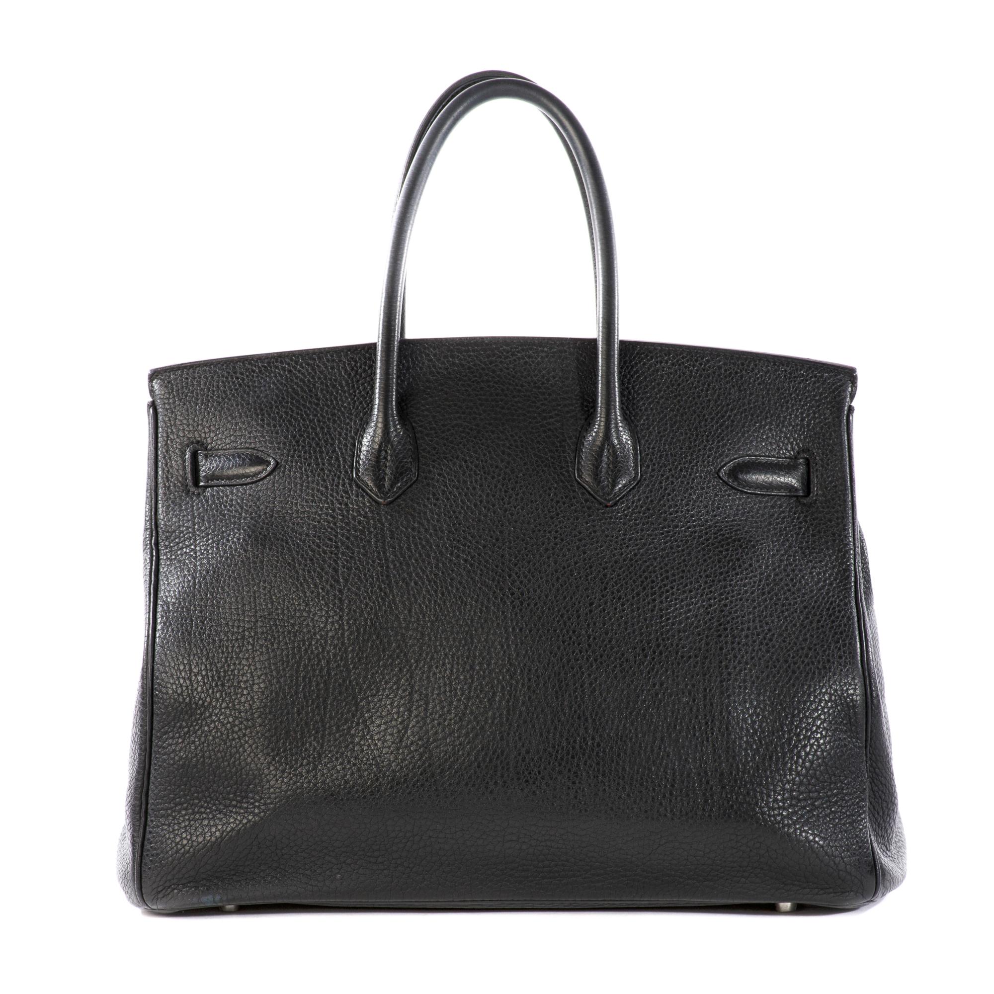 Authentic HERMES Togo Birkin 35 Black. This stylish tote is beautifully crafted of textured togo calfskin leather in black. The luxurious handbag features rolled leather top handles, a front flap, and strap closure with gold hardware including a