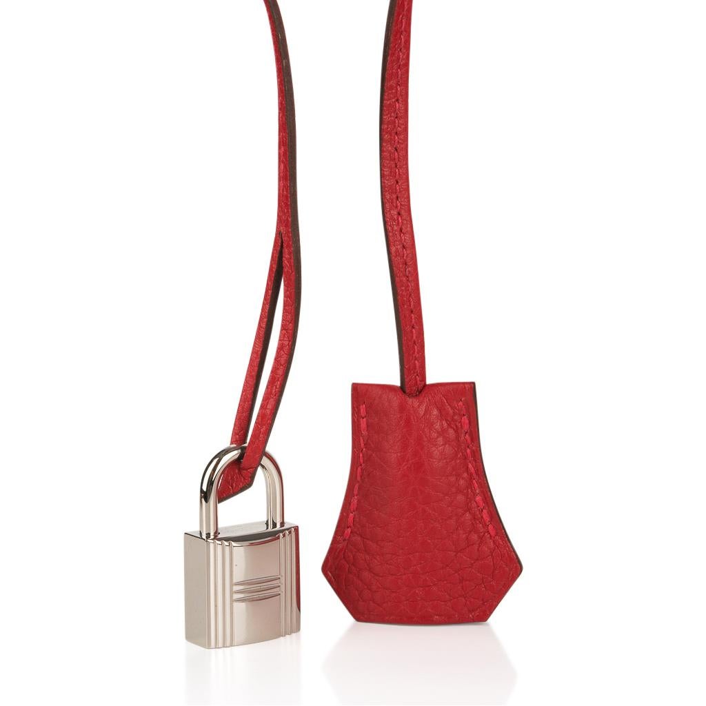 Guaranteed authentic Hermes Birkin 40 in classic Rouge Casaque and Togo leather.
Palladium hardware.  
Comes with lock, keys, clochette, sleepers, raincoat and signature Hermes box. 
Very few markings - see images
Hair line mark on lock and