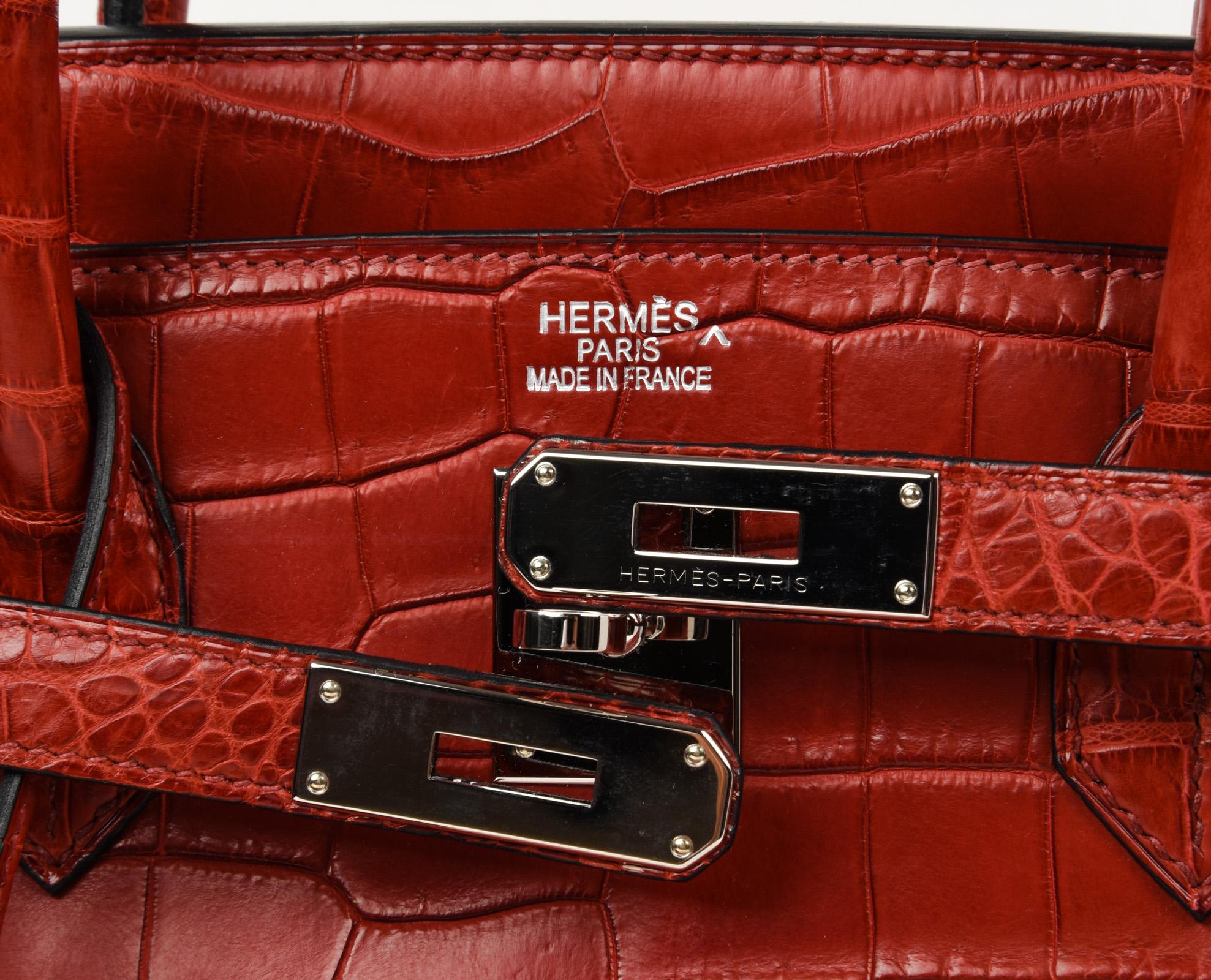 Guaranteed authentic Hermes Birkin 40 bag features rare coveted Matte red Porosus Crocodile. 
Fresh palladium hardware.
Extremely light wear marks on corners.
Light marking on hardware.
Clean handles and body.
Clean interior.
Comes with lock, keys,