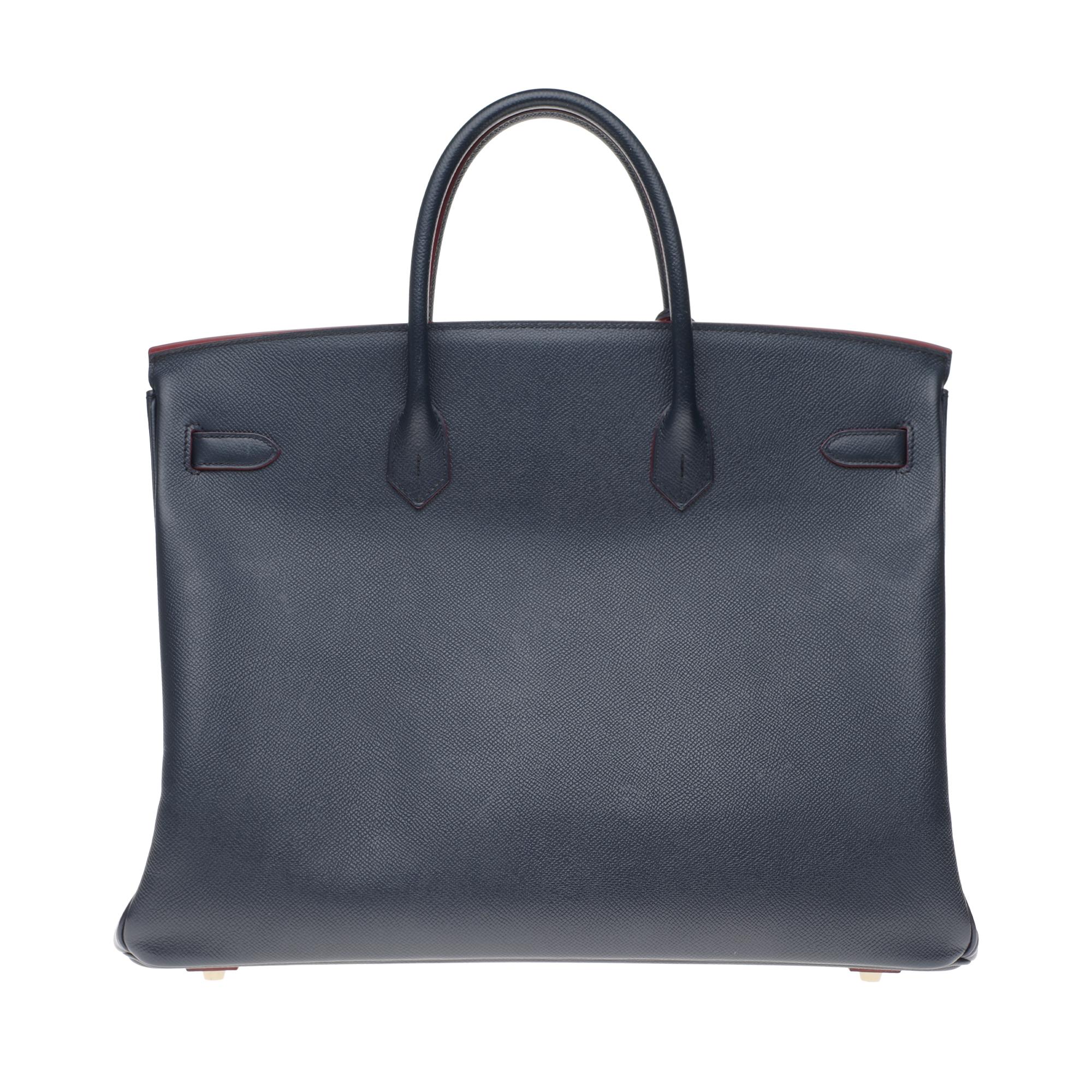 Superb & Rare Hermes Birkin 40 cm handbag in blue navy epsom leather with burgundy slices, gold plated metal trim, double blue leather handle for carrying.

Closure by flap.
Lining in blue leather, one zippered pocket, one patch pocket.
Signature: