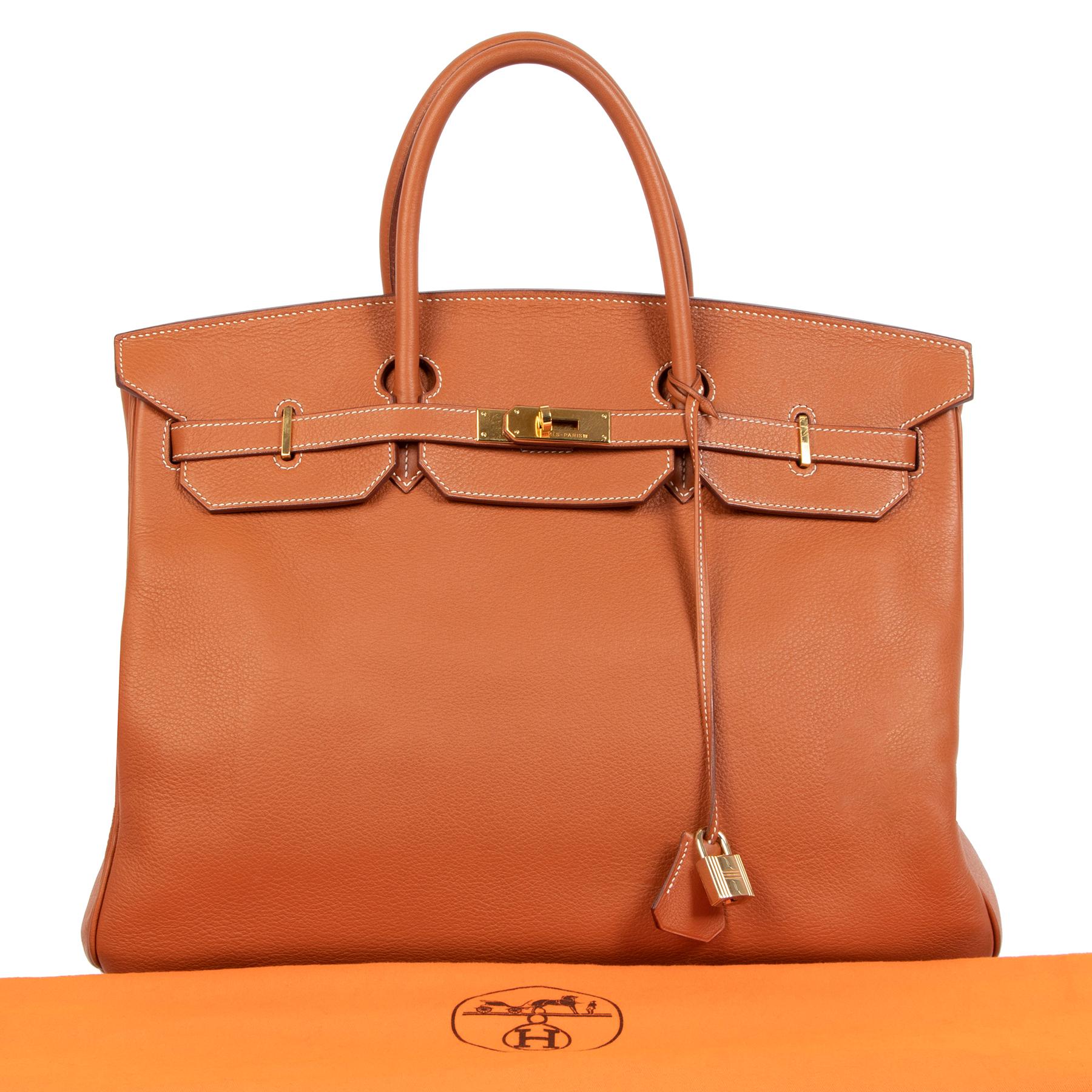 This spacious Hermès Birkin in the size 40 is crafted out of a warm orange-cognac colored hue called 