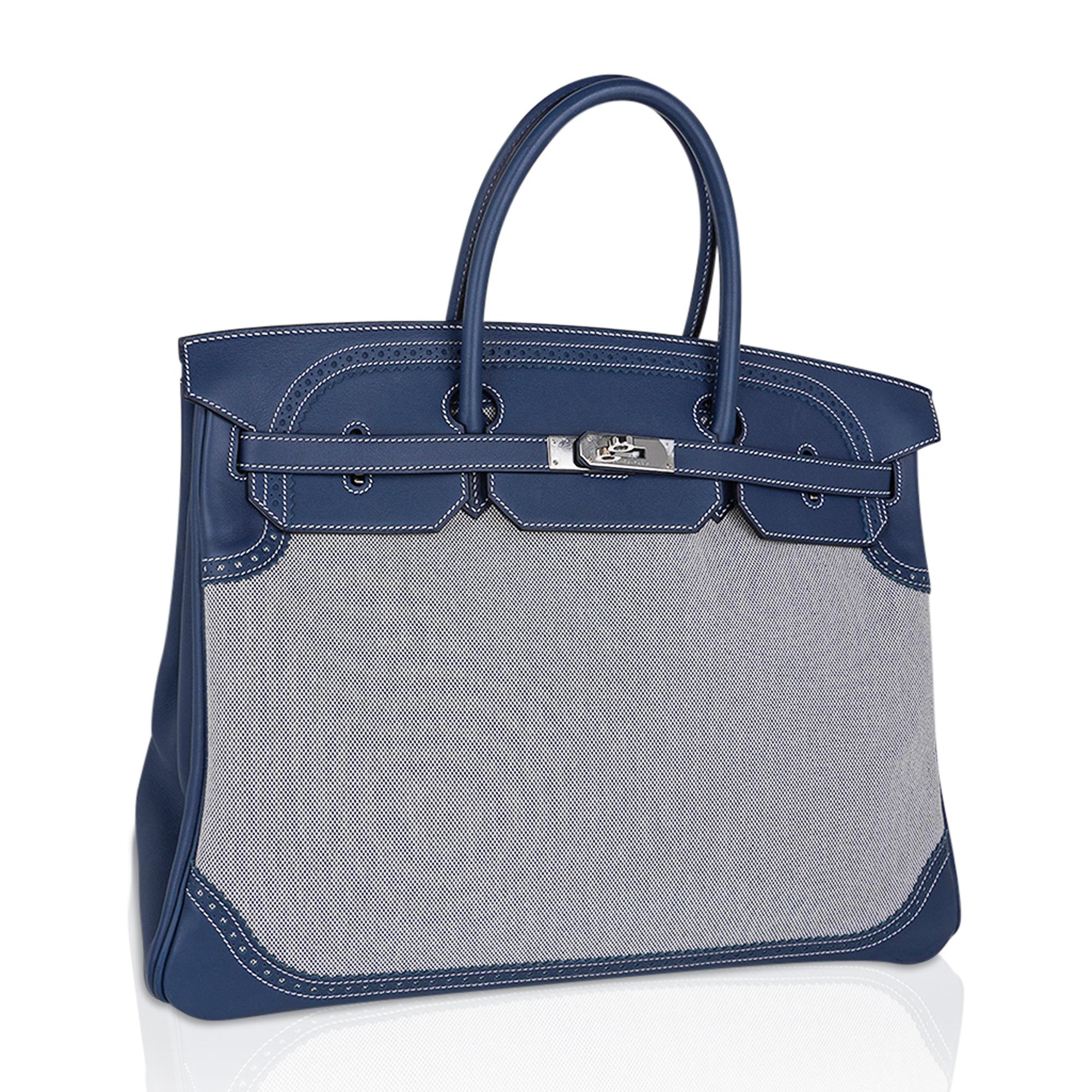 Mightychic offers a limited edition Hermes Birkin 40 Ghillies bag featured in Blue de Prusse with Blue Criss Cross Toile.
Brought to life by Pierre Hardy who drew from his heritage for this rare striking bag.
Exquisite combination with Swift