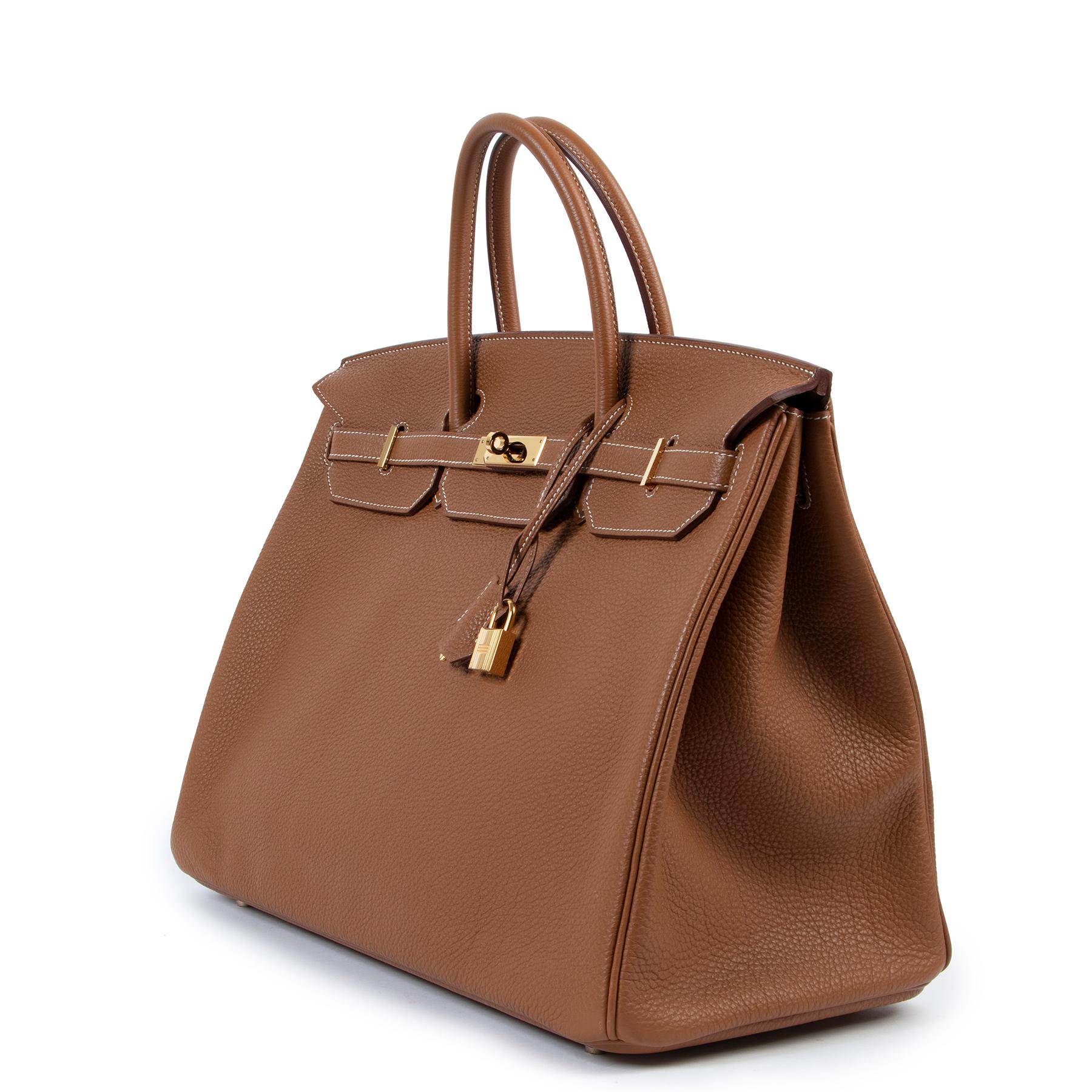 Hermès Birkin 40 Gold Togo GHW

This stunning and rare Hermès Birkin in the size 40 is made entirely of classic Togo leather, accentuated with the iconic double saddle stiching in natural linnen thread and warm golden toned hardware.

Comes