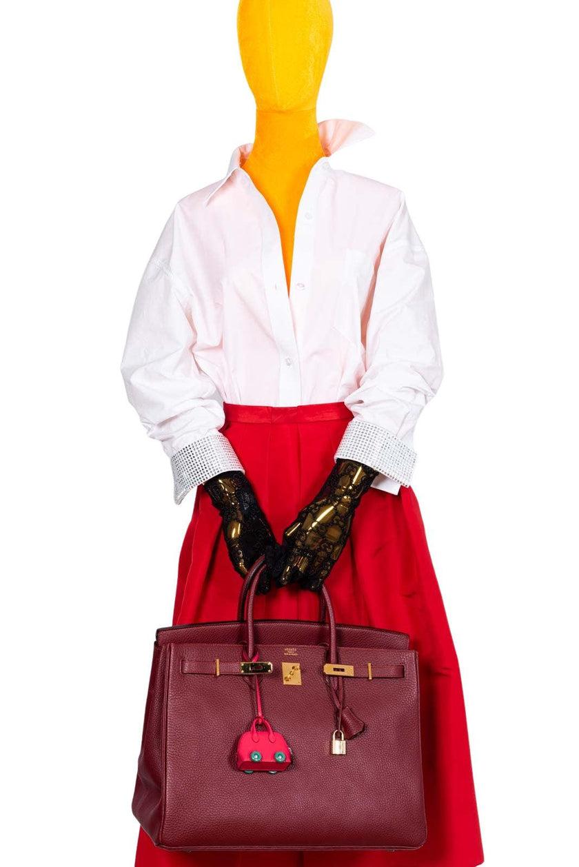 Hermès Birkin 40 Rouge H Vachette Fjord with Gold Hardware

Hermès, the epitome of luxury and exclusivity, has once again proven its mastery of craftsmanship with the Rouge H Vachette Fjord leather Birkin 40cm. This stunning bag glimmers in the