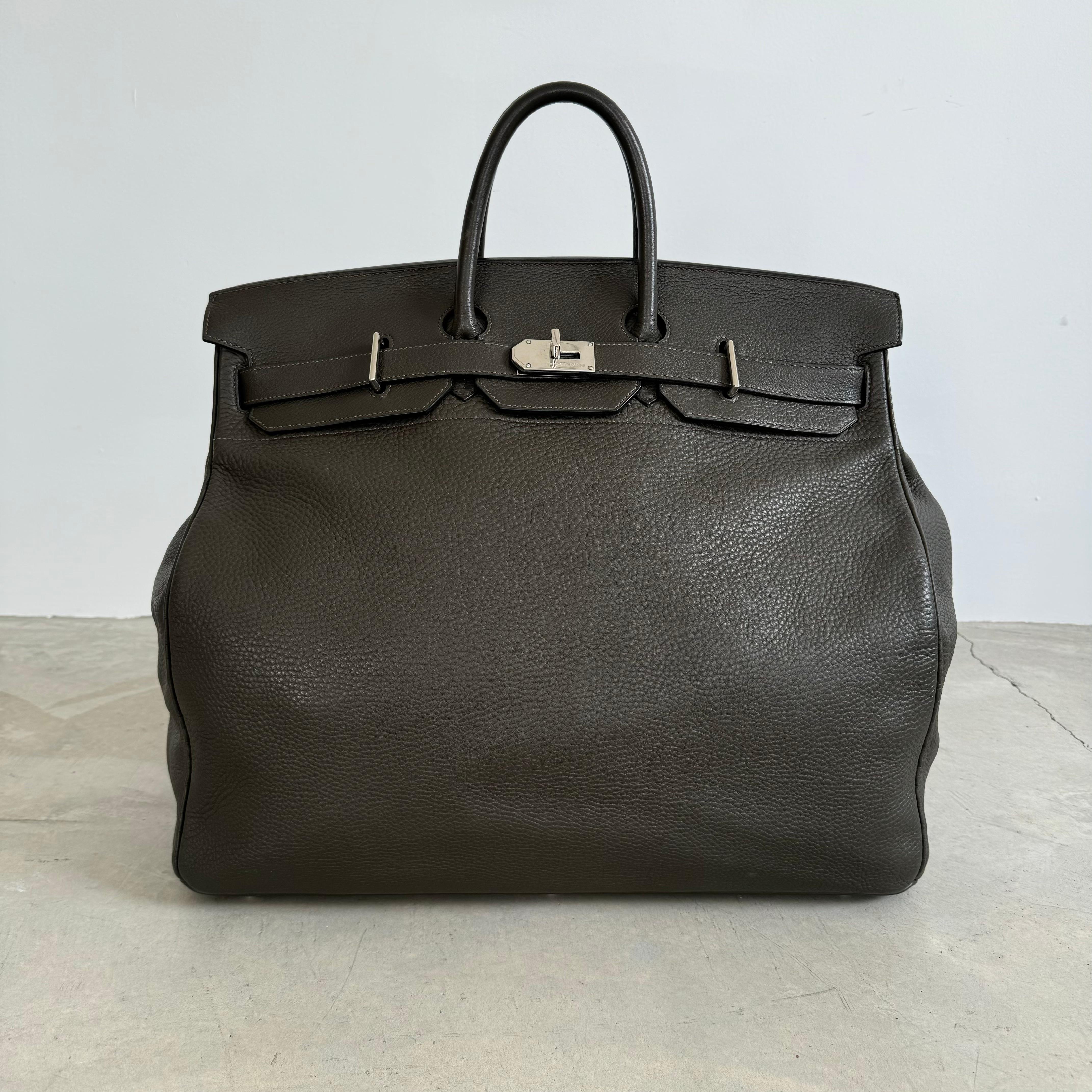 Gorgeous, authentic Hermes 50cm HAC Birkin. Dark brown leather with chrome finish hardware, dual-belt turnstile lock closure. Embossed above the closure is spelled in silver lettering 