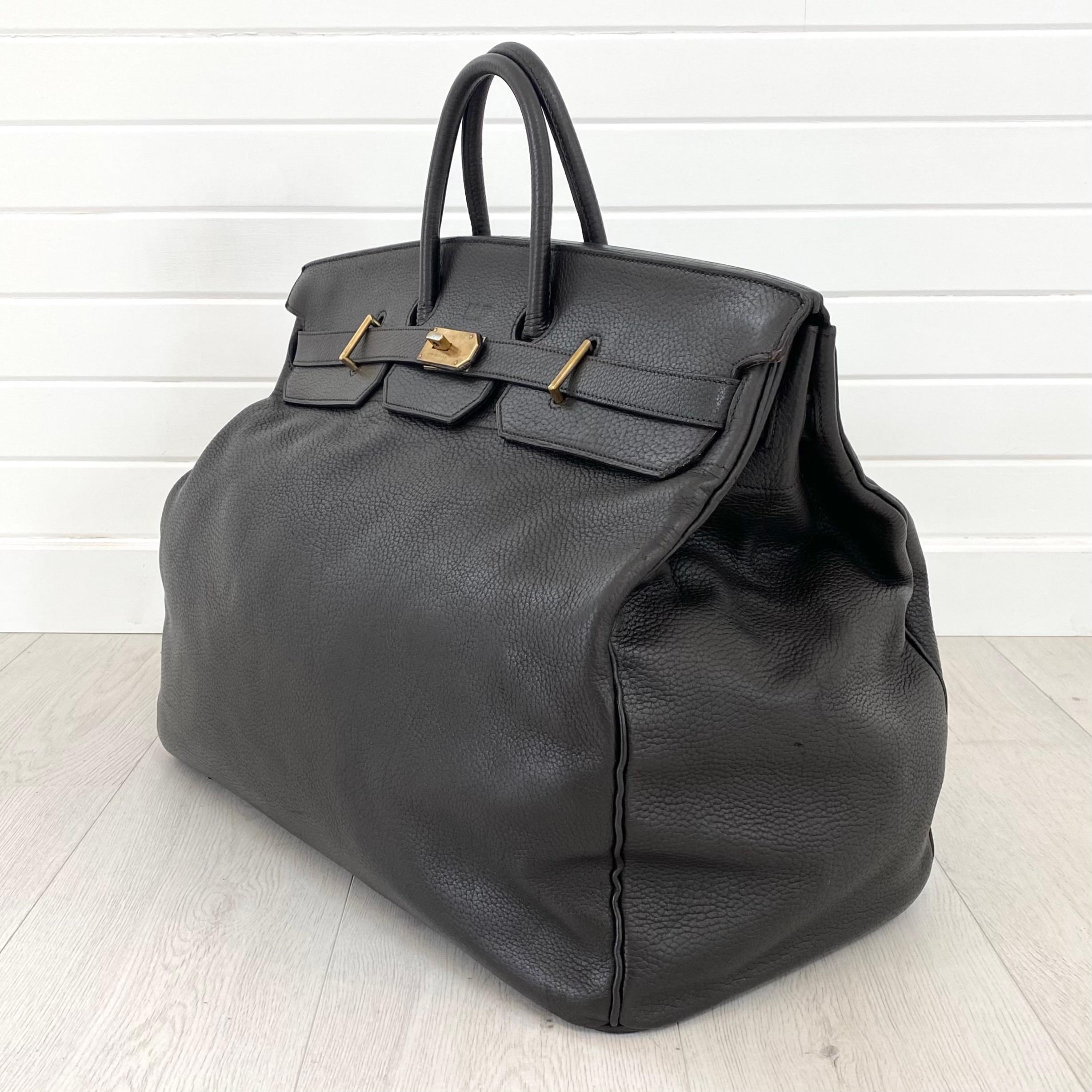 Gorgeous, authentic Hermes 55cm HAC Birkin. Dark brown leather with vintage brass hardware, dual-belt turnstile lock closure. Above the closure is a monogram spelling 