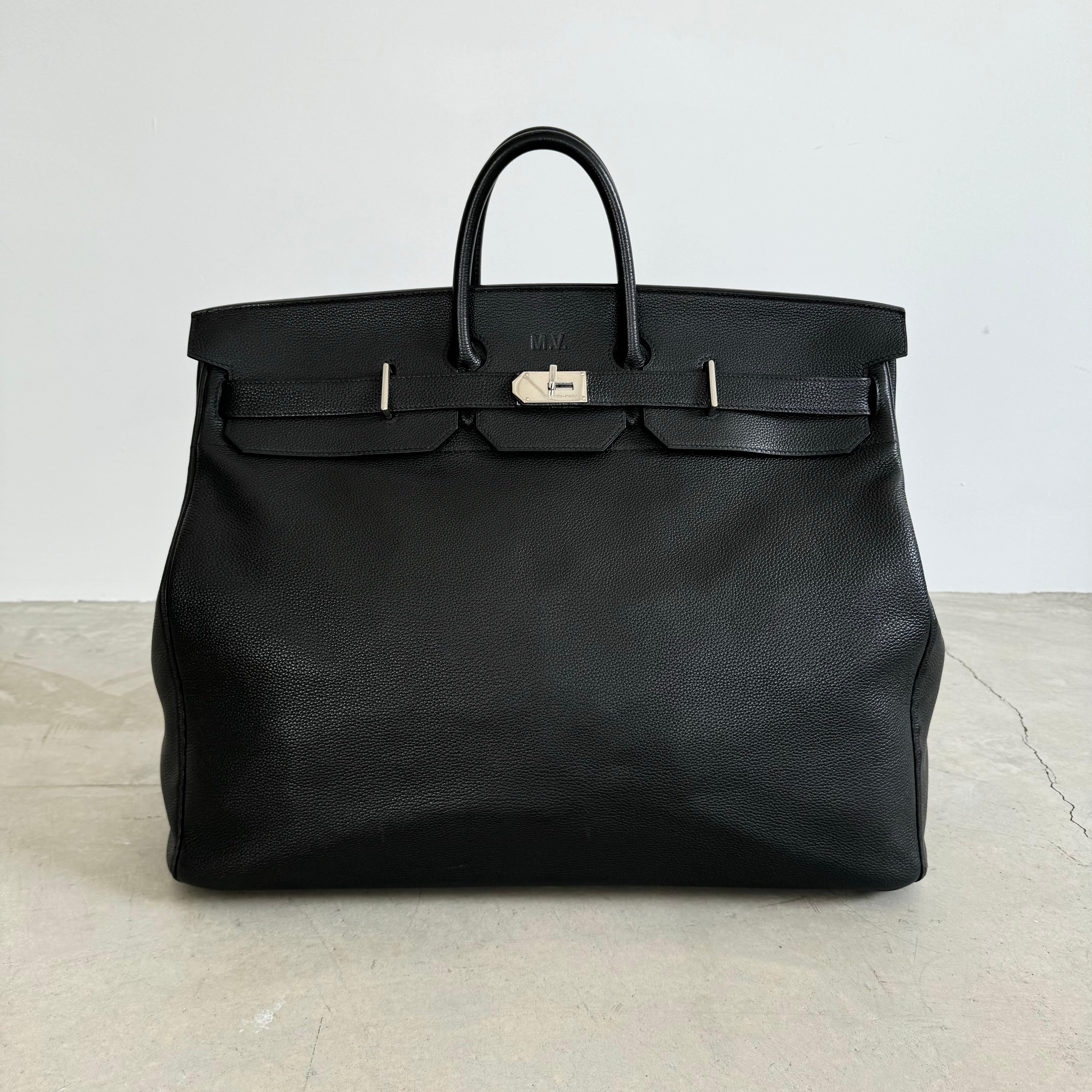 Gorgeous, authentic Hermes 55cm HAC Birkin. Black leather with chrome Palladium hardware, dual-belt turnstile lock closure. Above the closure on the lip of the bag is a monogram spelling 