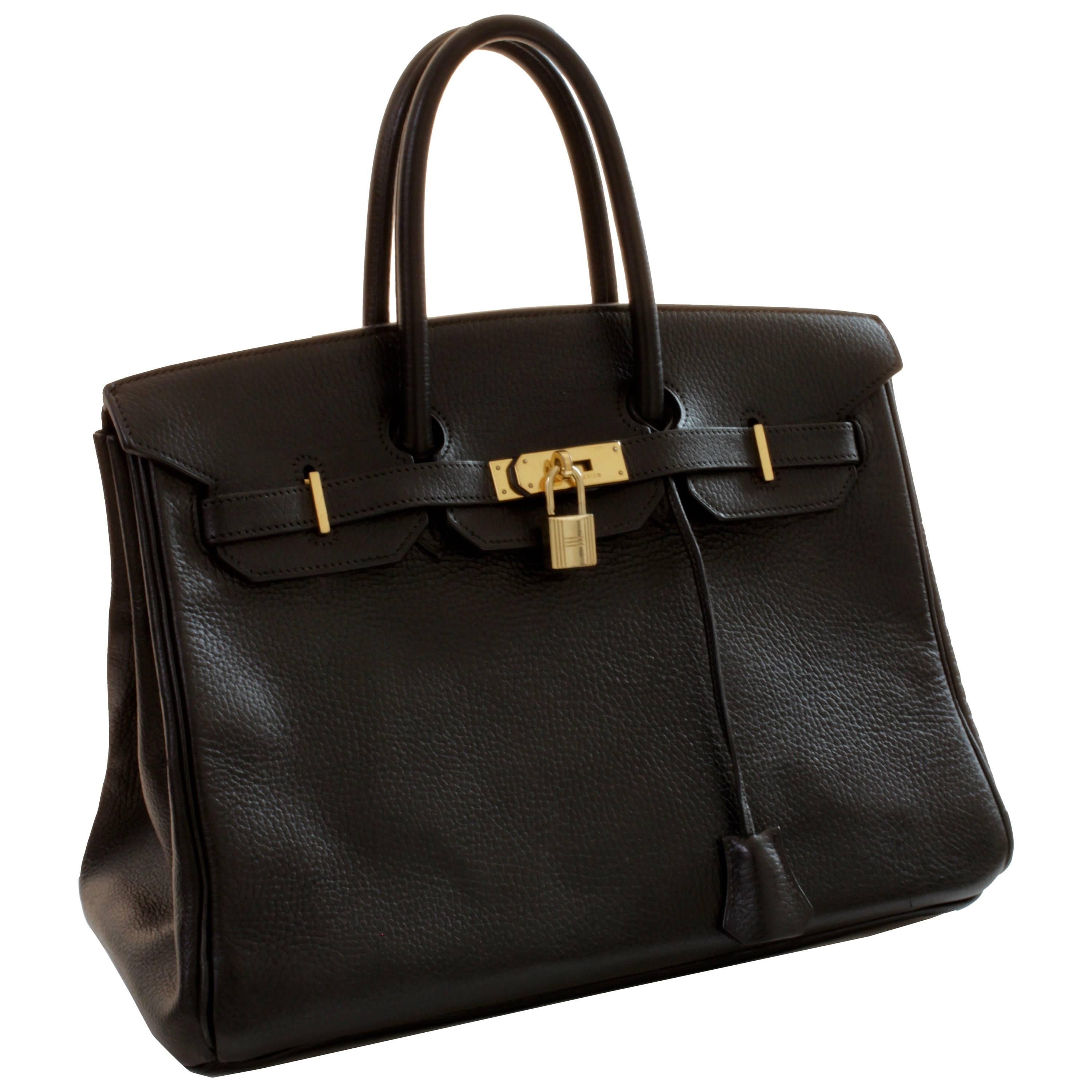 This Birkin is a lovely example of Hermes fine craftsmanship. Made from black Ardennes leather, which is one of the more durable and resilient hides and is no longer manufactured by Hermes. This iconic bag also features gold hardware. In very good