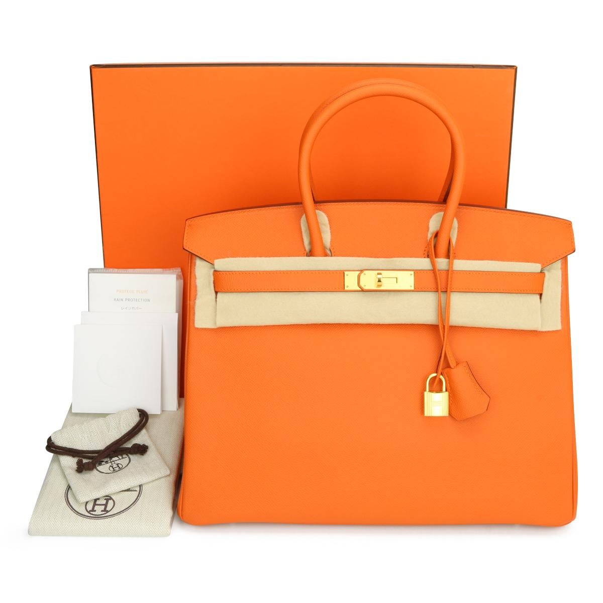 Hermès Birkin Bag 35cm Orange Epsom Leather with Gold Hardware Stamp Q_Year 2013.

This bag is still in never worn condition. The leather still smells fresh as when new, and it still holds to the original shape. The hardware is still very shiny and