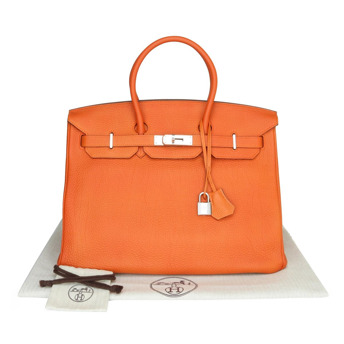 Hermès Birkin Bag 35cm Orange Togo Leather with Palladium Hardware Stamp M_Year 2009.

This bag is still in very good condition. The leather still smells fresh and holds to the original shape. The hardware is still very shiny.

A truly stunning