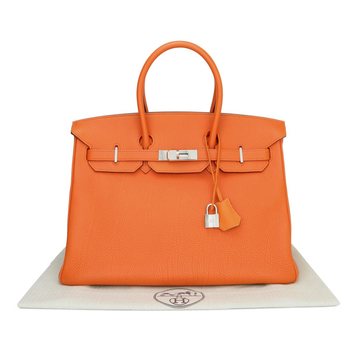Hermès Birkin Bag 35cm Orange Togo Leather with Palladium Hardware Stamp N_Year 2010.

This bag is still in very good condition. The leather still smells fresh, and it still holds to the original shape. The hardware is still very shiny.

A truly