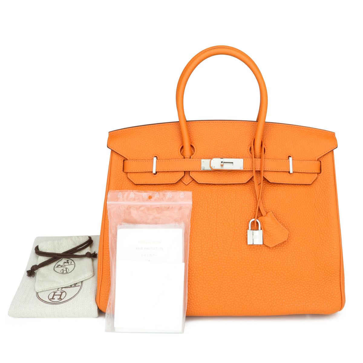 Hermès Birkin Bag 35cm Orange Togo Leather with Palladium Hardware Stamp N_Year 2010.

This bag is still in excellent condition. The leather still smells fresh, and it still holds to the original shape. The hardware is still very shiny.

A truly
