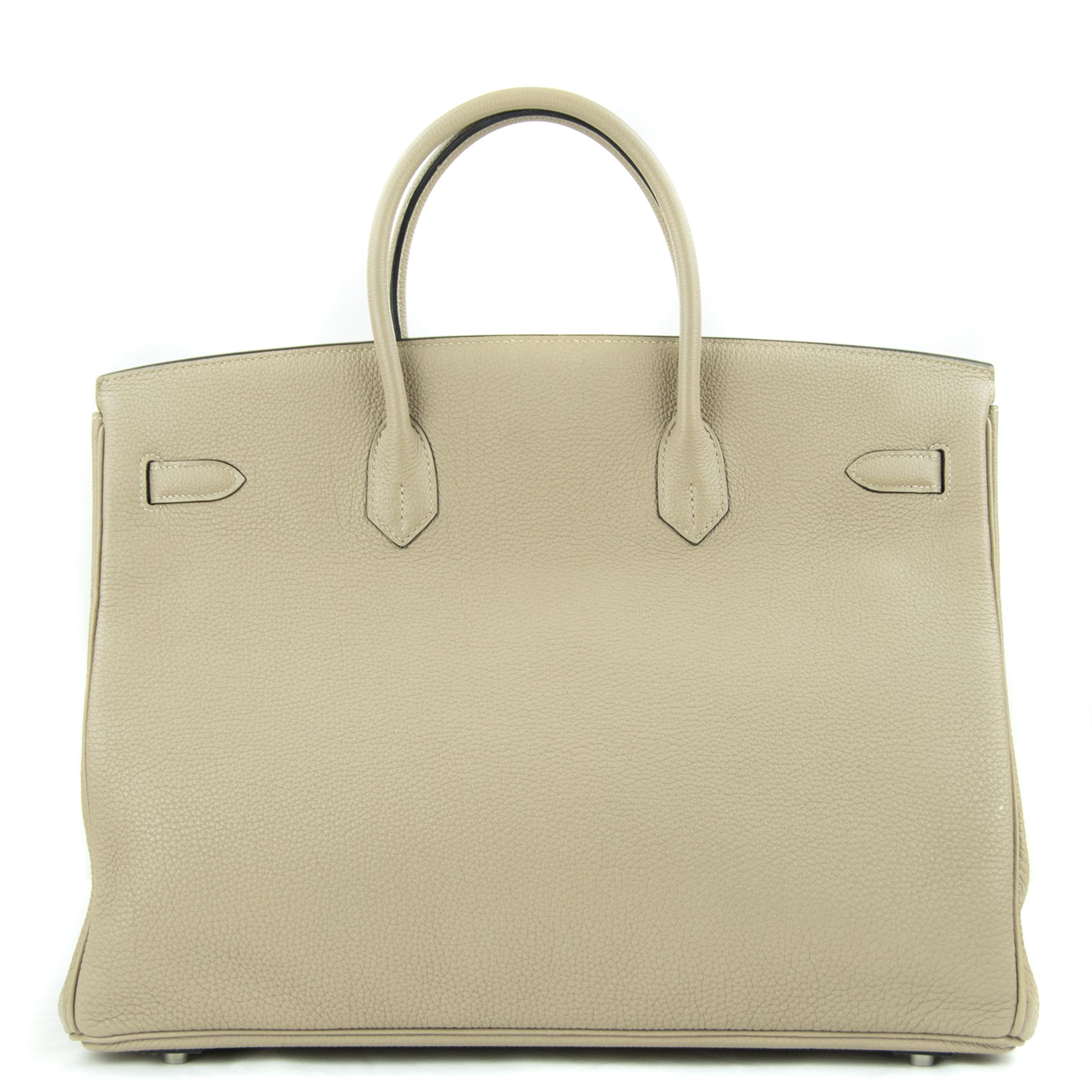 Hermes 40cm Birkin bag in Gris Tourterelle Togo. This iconic special order Hermes Birkin bag is timeless and chic. Fresh and crisp with palladium hardware.

    Condition: New or Never Used
    Made in France
    Bag Measures: 40cm (15.7