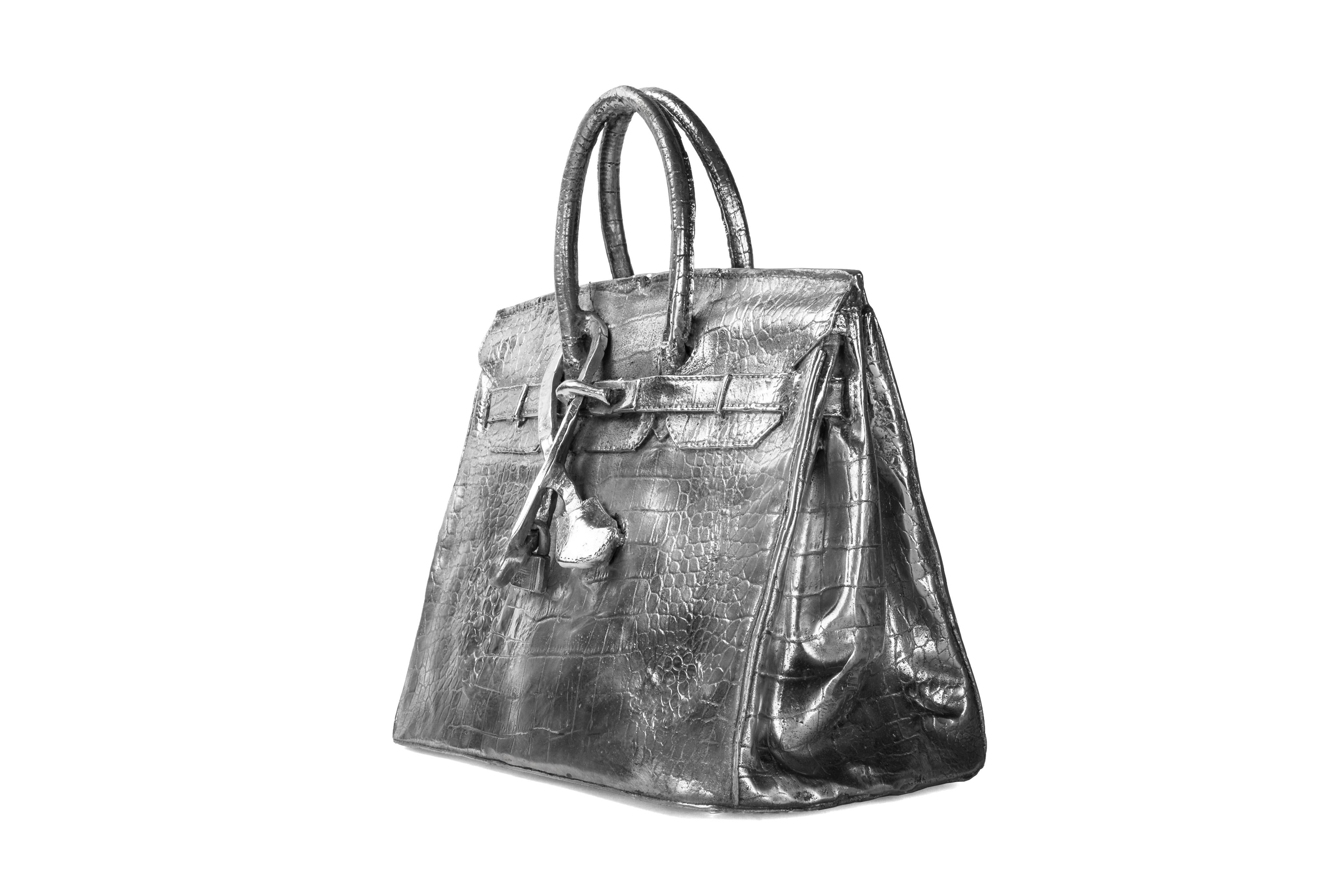 A wild and fantastic sculpture. An artist casted a Hermes birkin bag out of aluminum. The results are a vividly real bag, but about 20lbs heavier. Truly a cherry on top for a Hermes bag enthusiast.