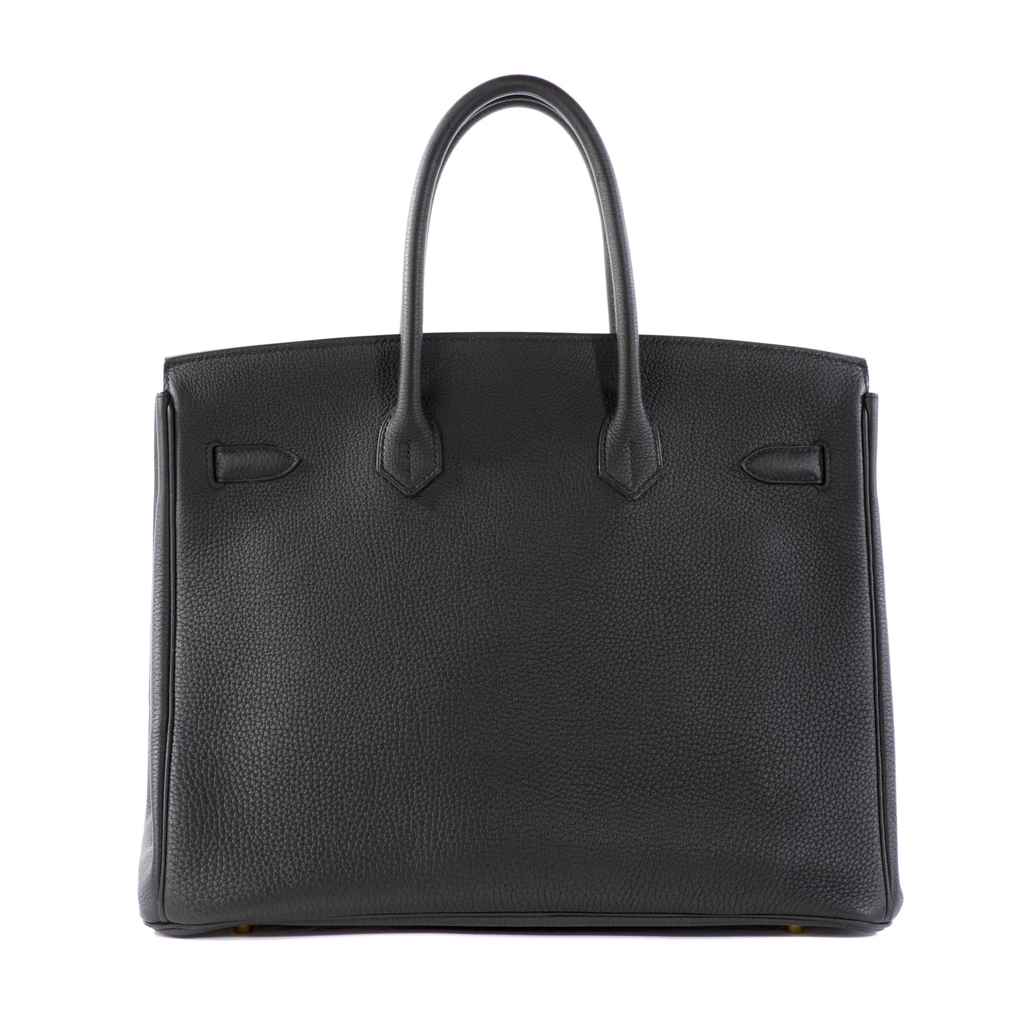 Black Togo leather Hermès Birkin 35 with gold-plated hardware, stamp T (2015) rolled top handles, protective feet at base, tonal leather lining, dual pockets at interior walls; one with zip closure and turn-lock closure at front flap. 
Packaging :