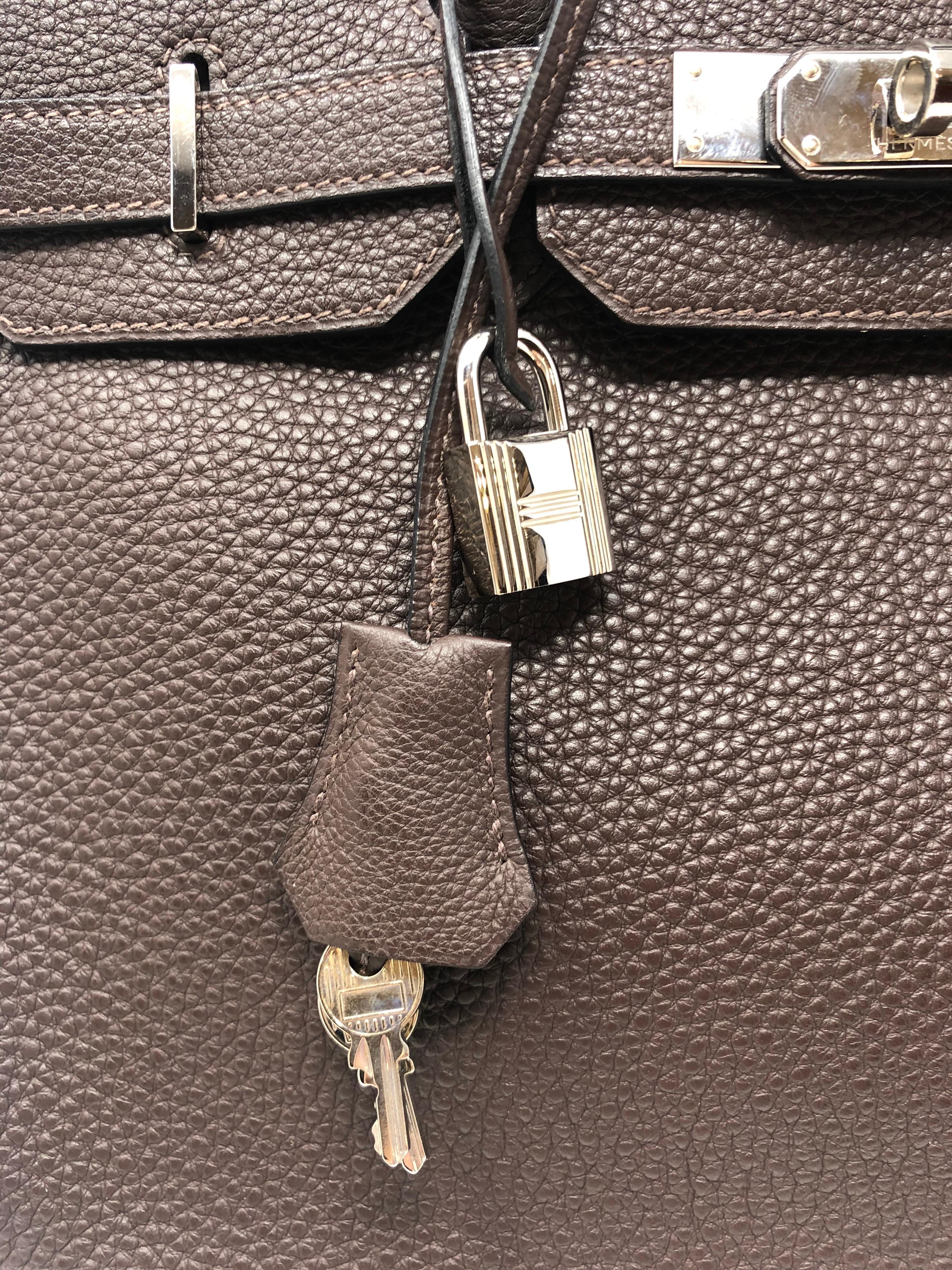 Hermes Dark Brown Birkin 30 with Palladium hardware. Rare size and most wanted. Excellent like new condition. Plastic still on hardware. Togo leather. Includes lock, keys, clochette, and dust cover. Guaranteed authentic. 