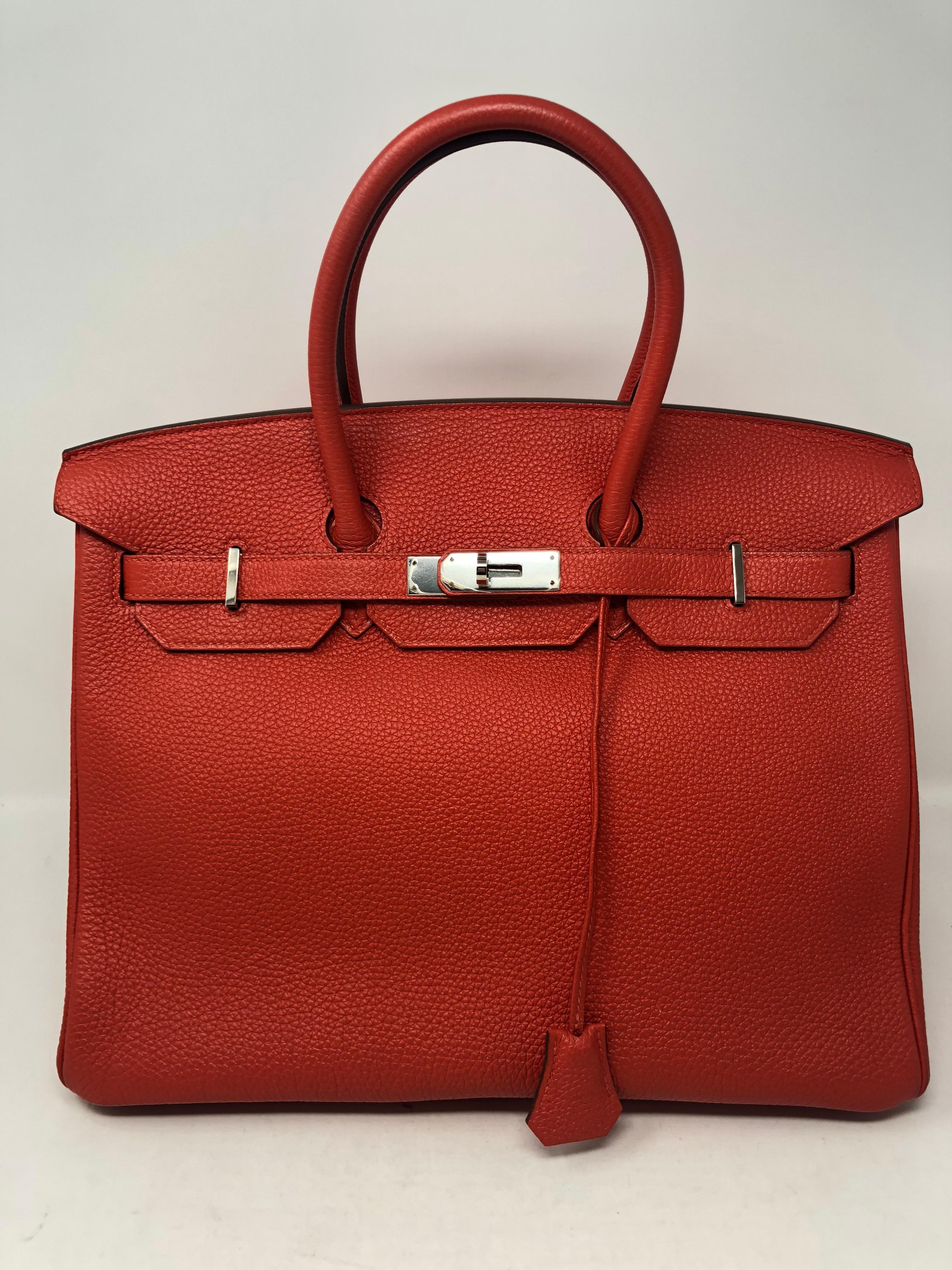Hermes Birkin 35 in Cappucine Red color. Looks brand new condition. Beautiful color and nice togo leather. Palladium hardware. Includes dust cover, clochette, lock and keys. Guaranteed authentic. 