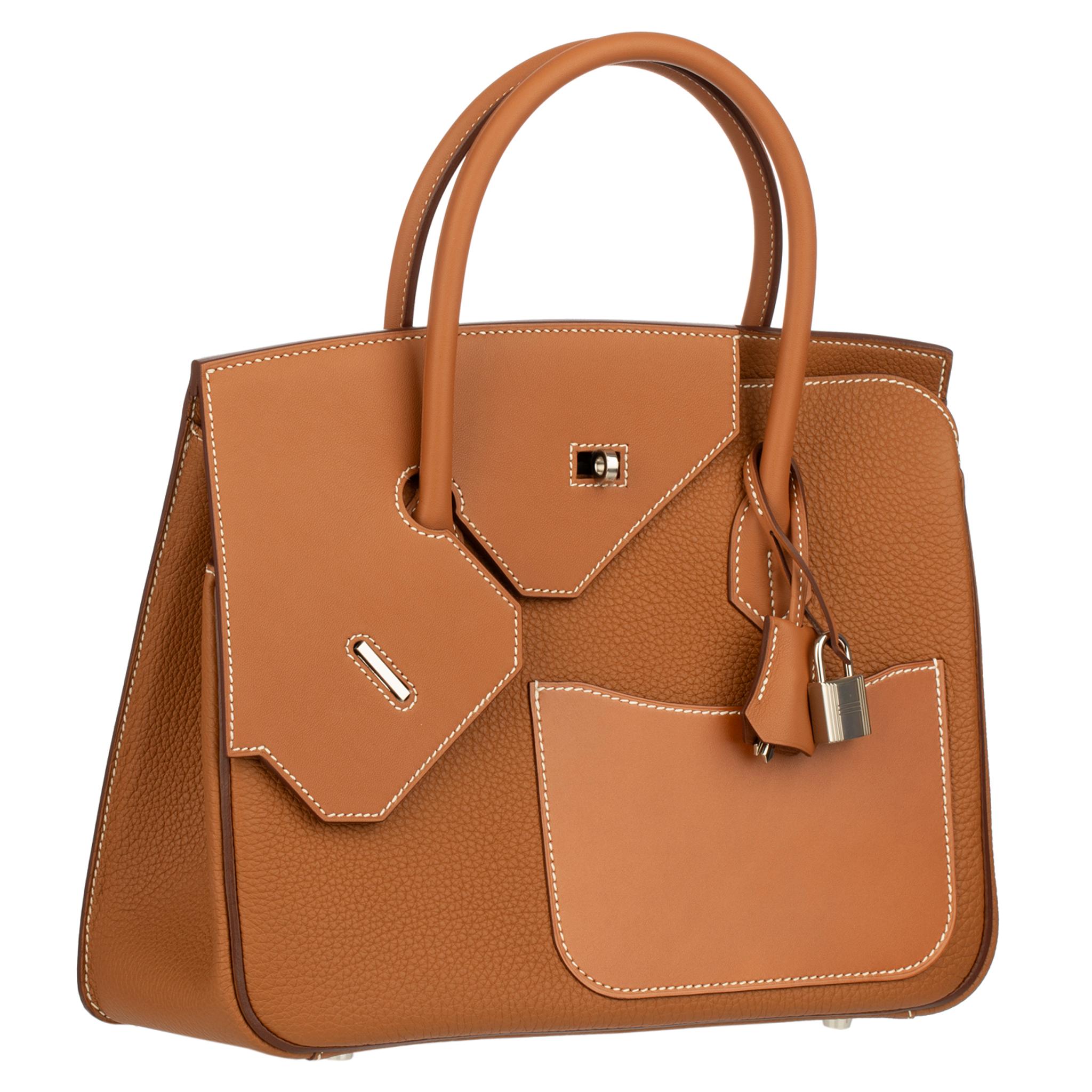 The Hermes Birkin Desordre 30cm in Gold Togo and Swift Leather with Palladium Hardware is a bold fusion of textures and hues, redefining luxury with its unique design.

Crafted meticulously by Hermes artisans, this exceptional bag showcases the