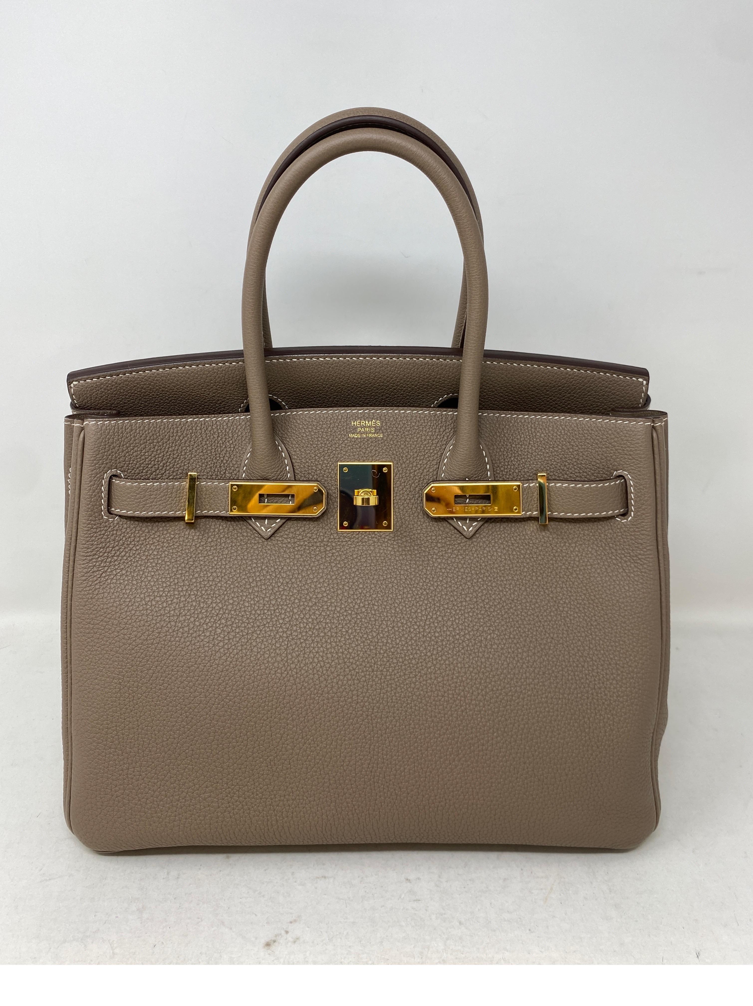 Hermes Etoupe Birkin 30 Bag. Newer bag.  Gold hardware. Rare color combination. Most wanted size 30. Includes full set. Includes clochette, rain jacket, lock, keys, dust bag and box. Better than gold. Guaranteed authentic. 