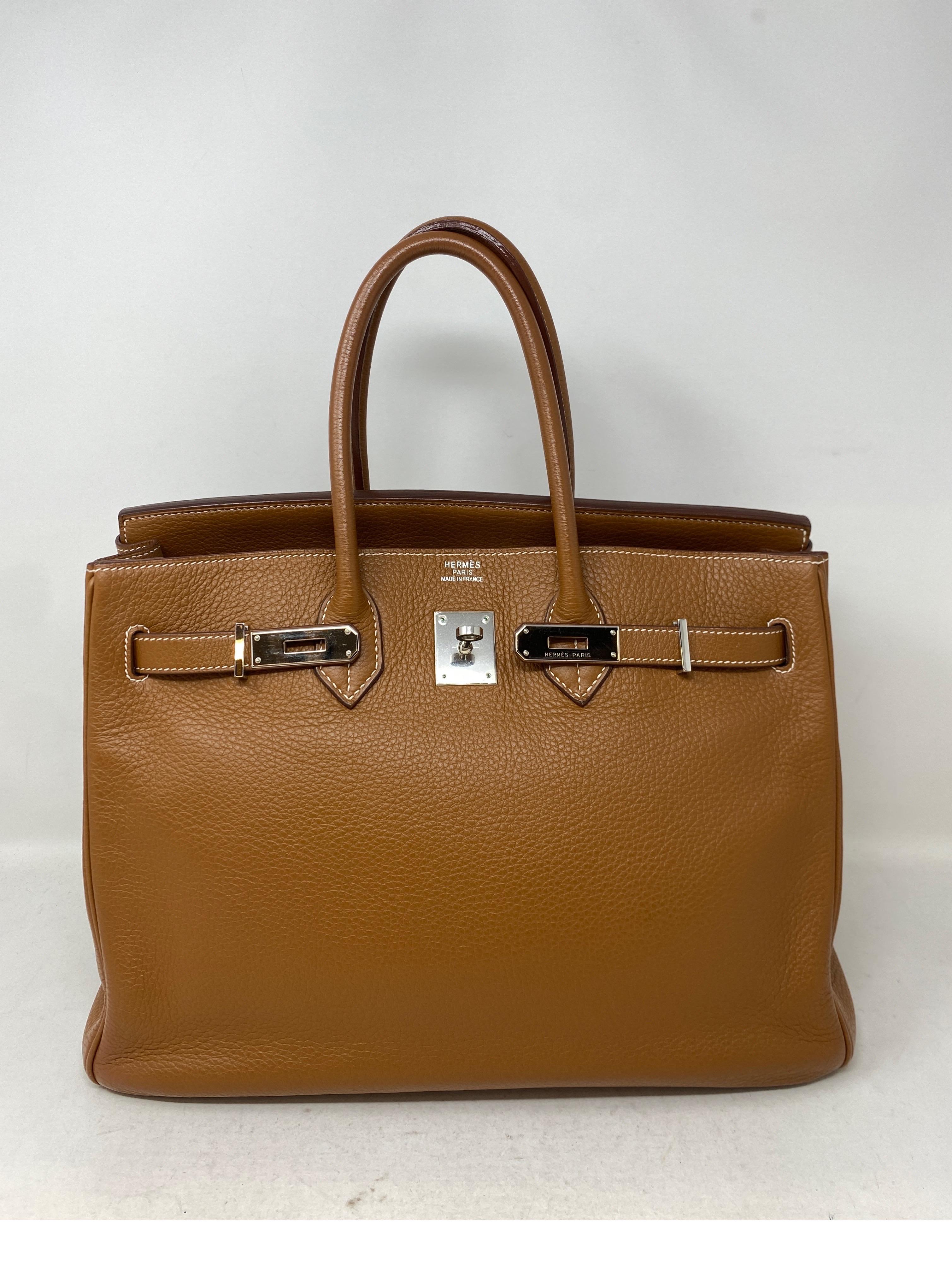 Hermes Gold Birkin 35 Bag. Clemence leather. Palladium hardware. Excellent condition. Most sought after color gold leather. Classic tan color. Includes clochette, lock, keys, and dust bag. Guaranteed authentic. 