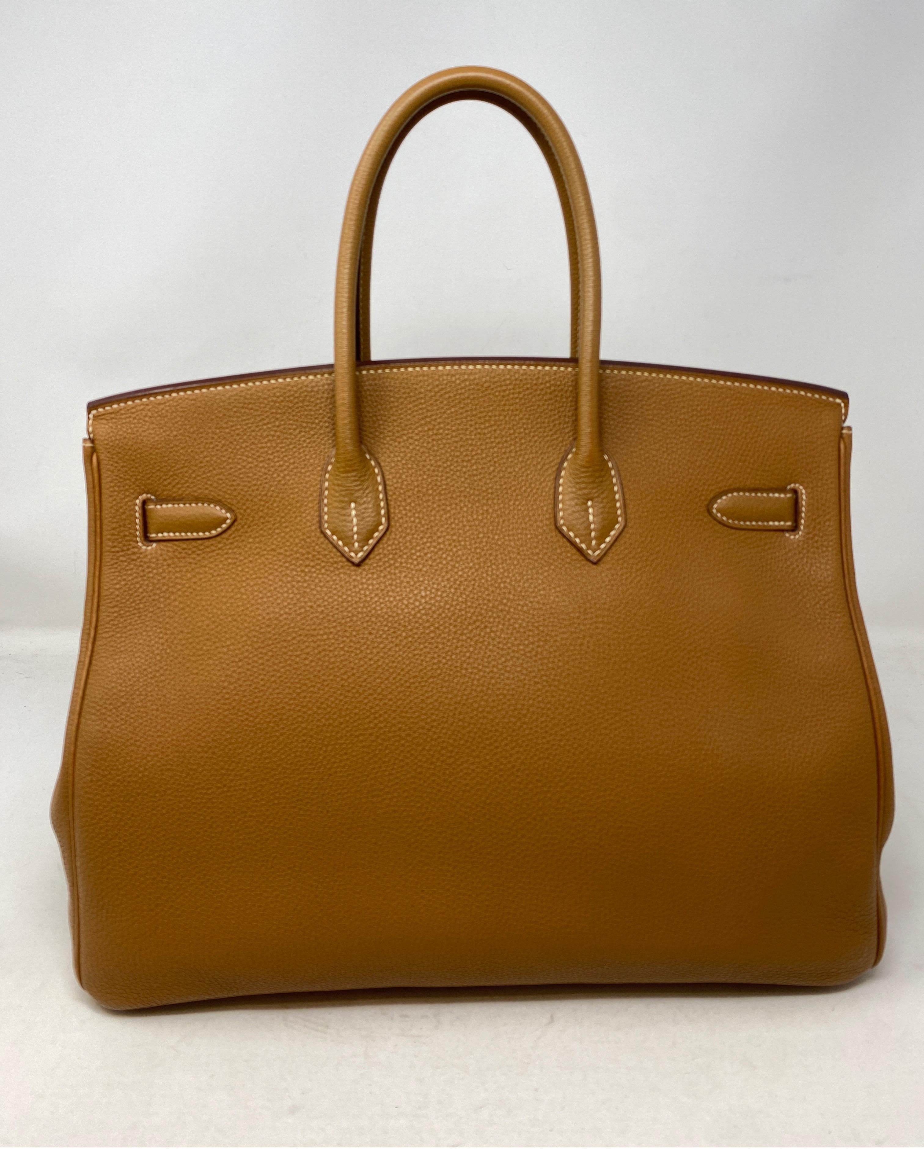 Hermes Gold Birkin 35 Bag. Gold tan color with gold hardware. The most wanted combination for Birkin. Togo leather. Great investment bag. Mint like new condition. Still has plastic on hardware. Beautiful bag. This combo is going up in pricing. Don't
